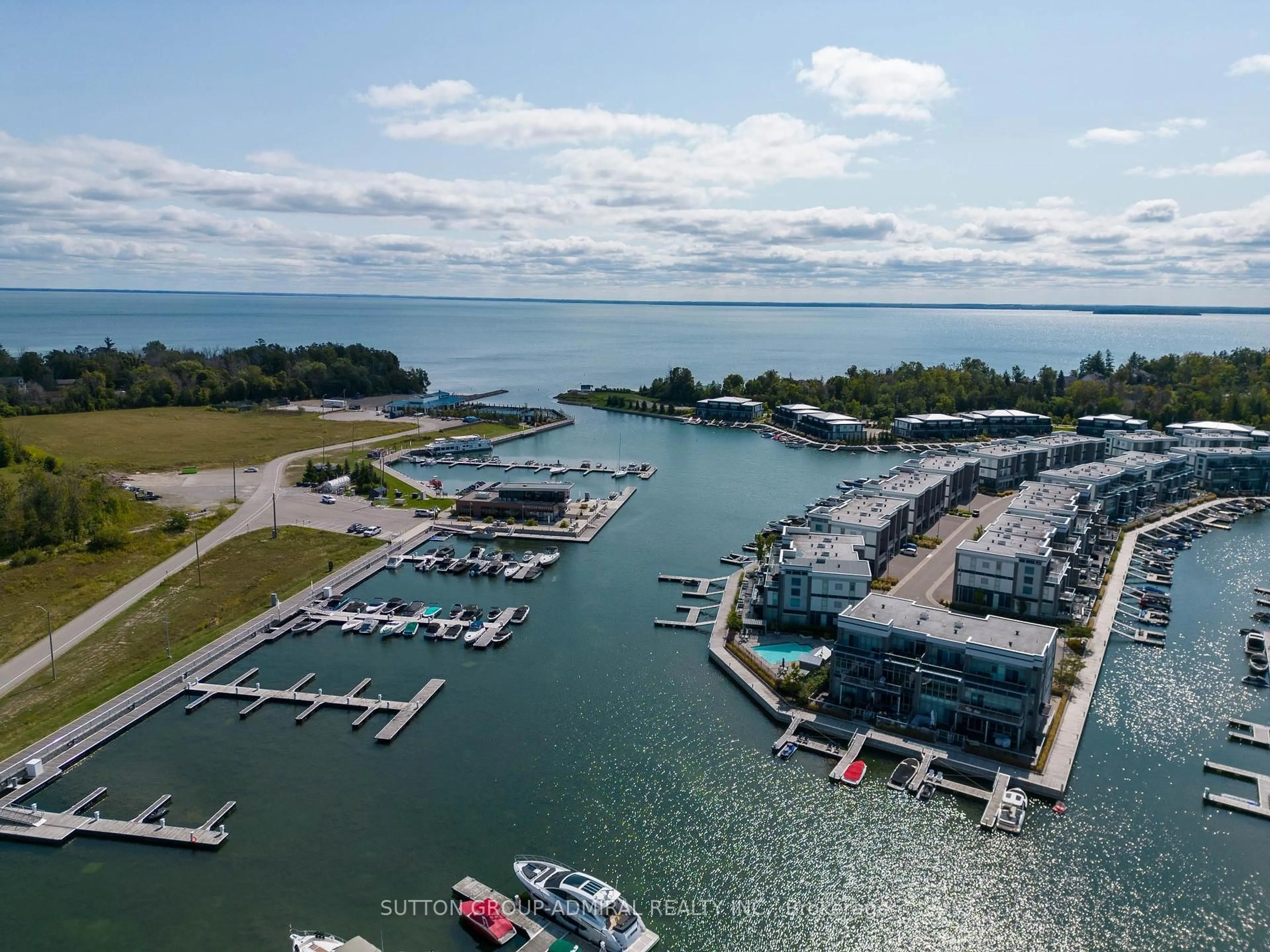 A pic from outside/outdoor area/front of a property/back of a property/a pic from drone, water/lake/river/ocean view for 415 Sea Ray Ave #431, Innisfil Ontario L9S 0R5
