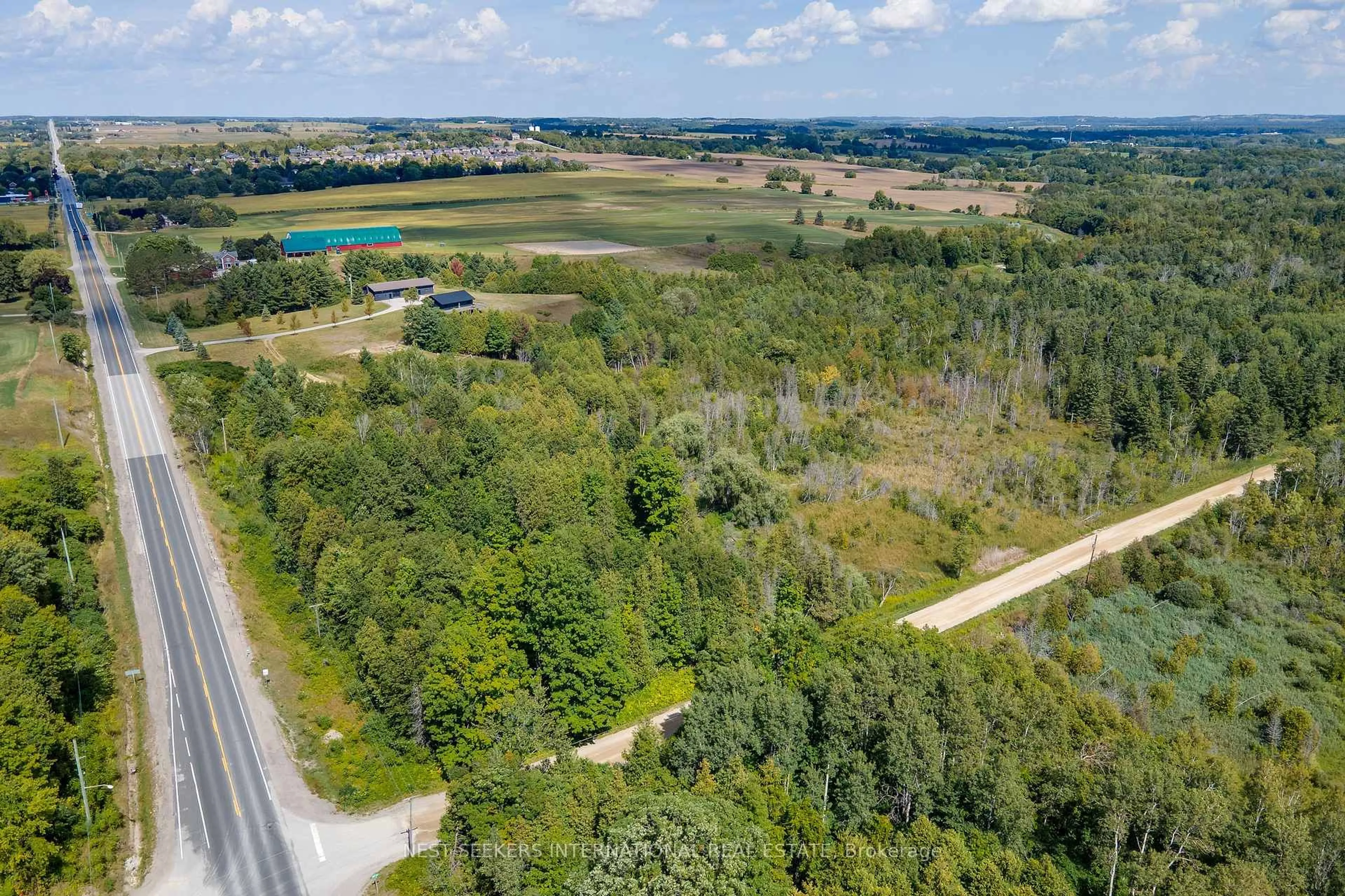 A pic from outside/outdoor area/front of a property/back of a property/a pic from drone, forest/trees view for 5181 County Road 27, Innisfil Ontario L0L 1L0