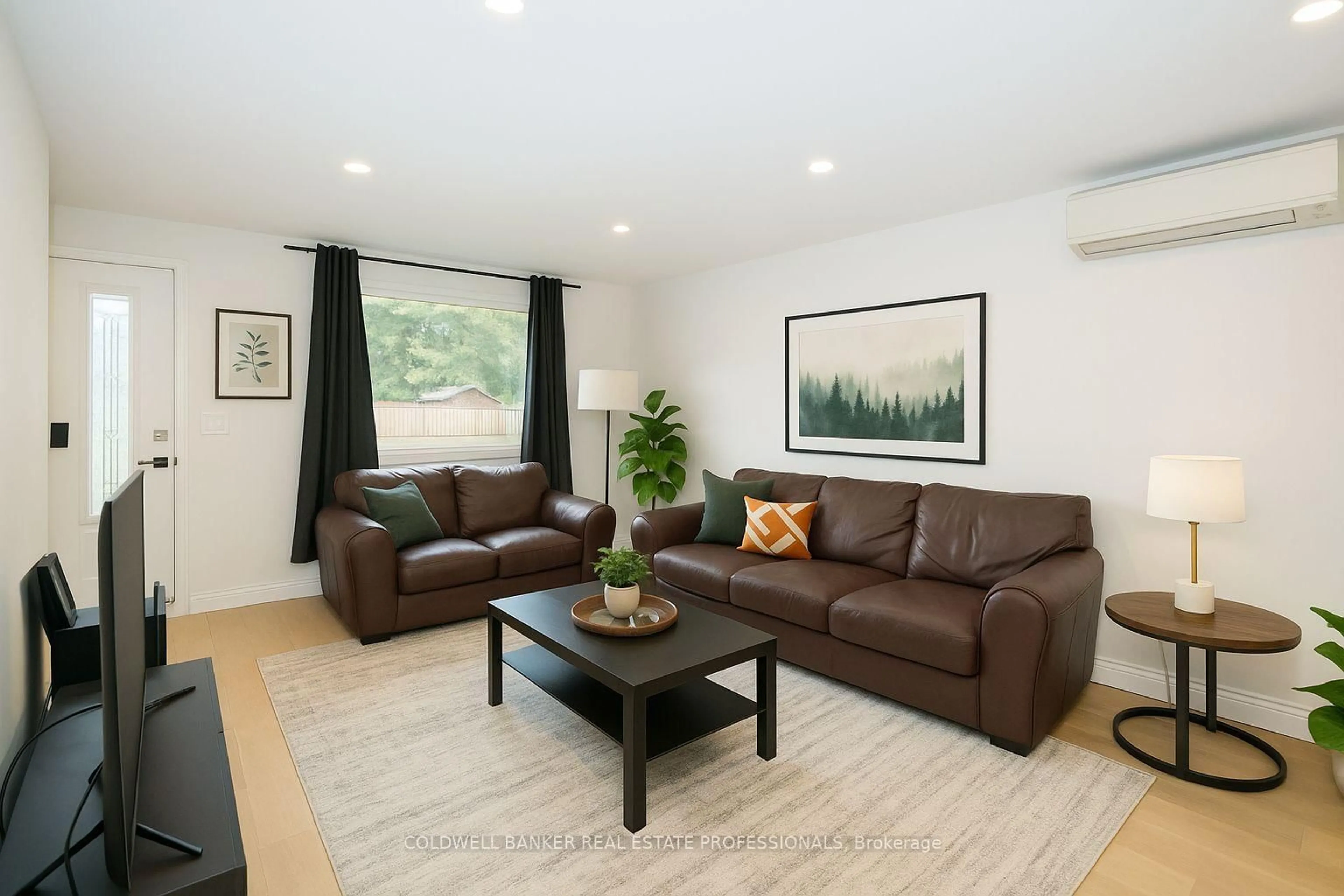 Living room with furniture, wood/laminate floor for 235 Simcoe Ave, Georgina Ontario L4P 2H9