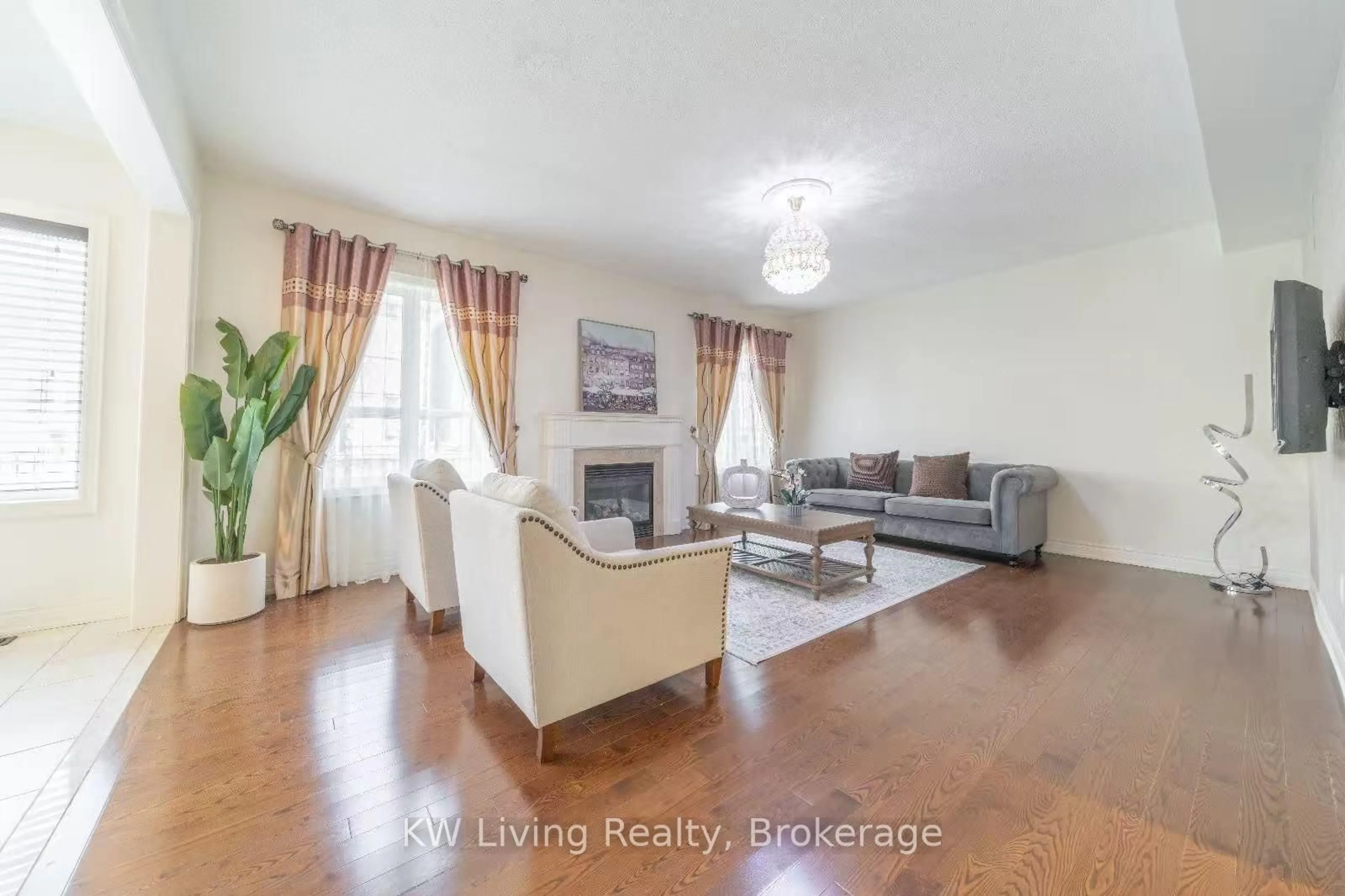 Living room with furniture, wood/laminate floor for 106 Hua Du Ave, Markham Ontario L6C 0R2