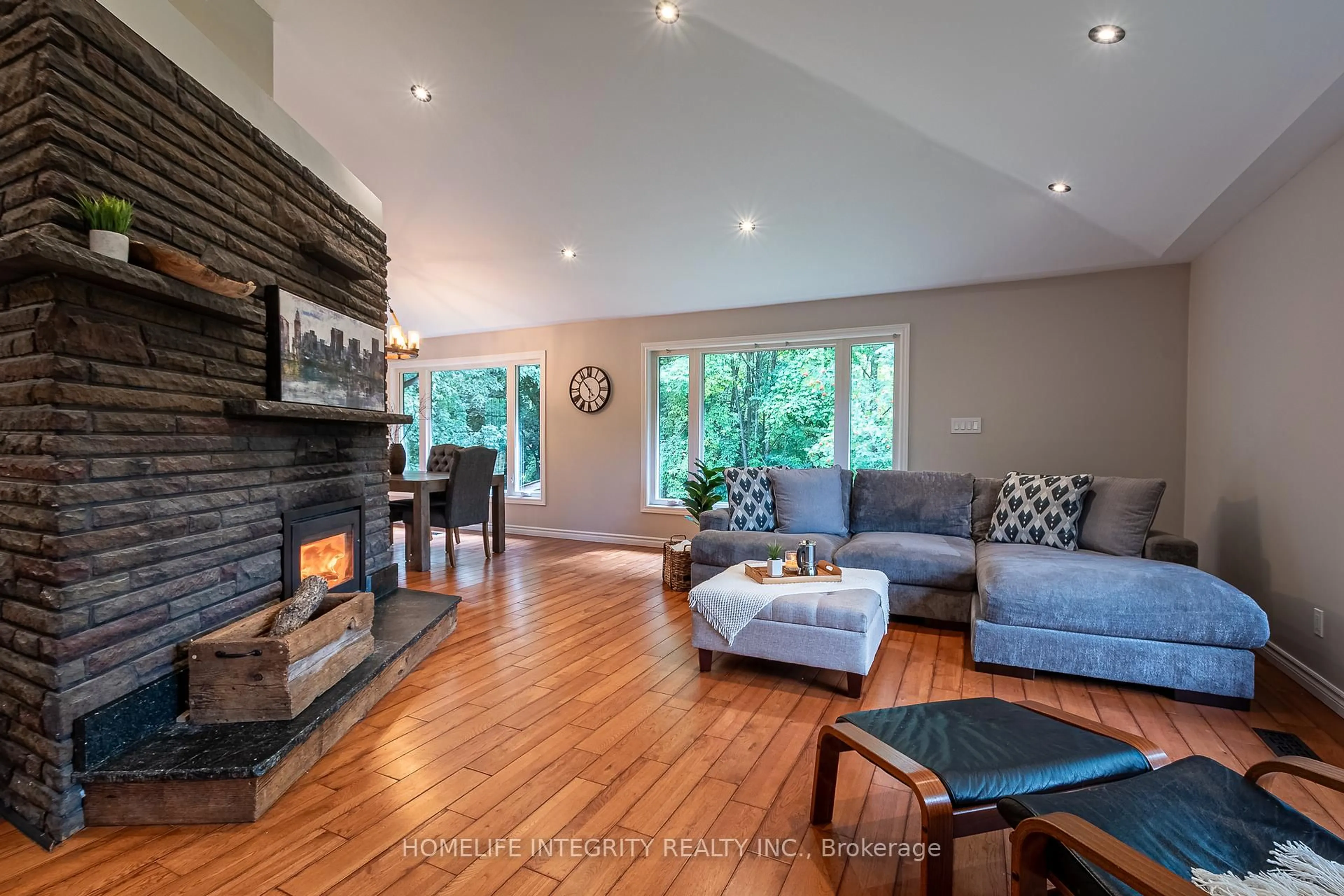 Living room with furniture, wood/laminate floor for 37 Manniku Rd, Georgina Ontario L9P 1R2