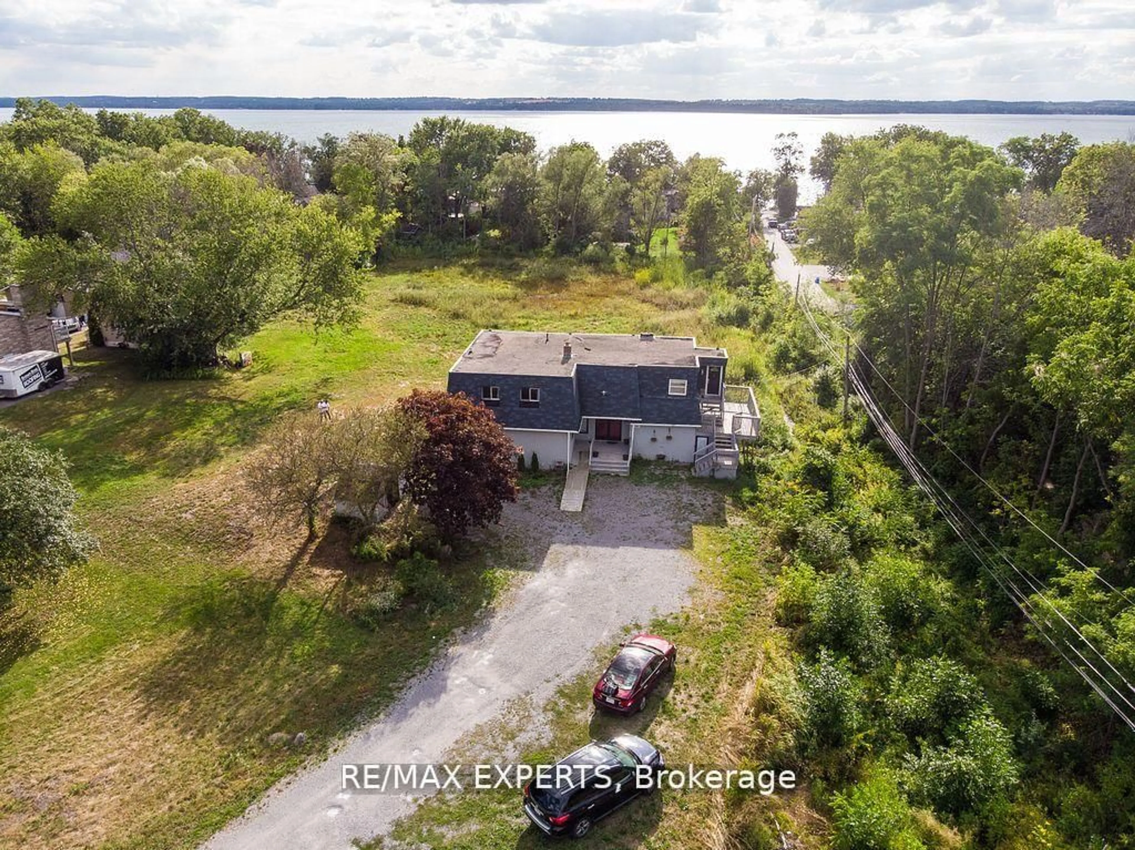 A pic from outside/outdoor area/front of a property/back of a property/a pic from drone, water/lake/river/ocean view for 300 Metro Rd, Georgina Ontario L4P 3C8