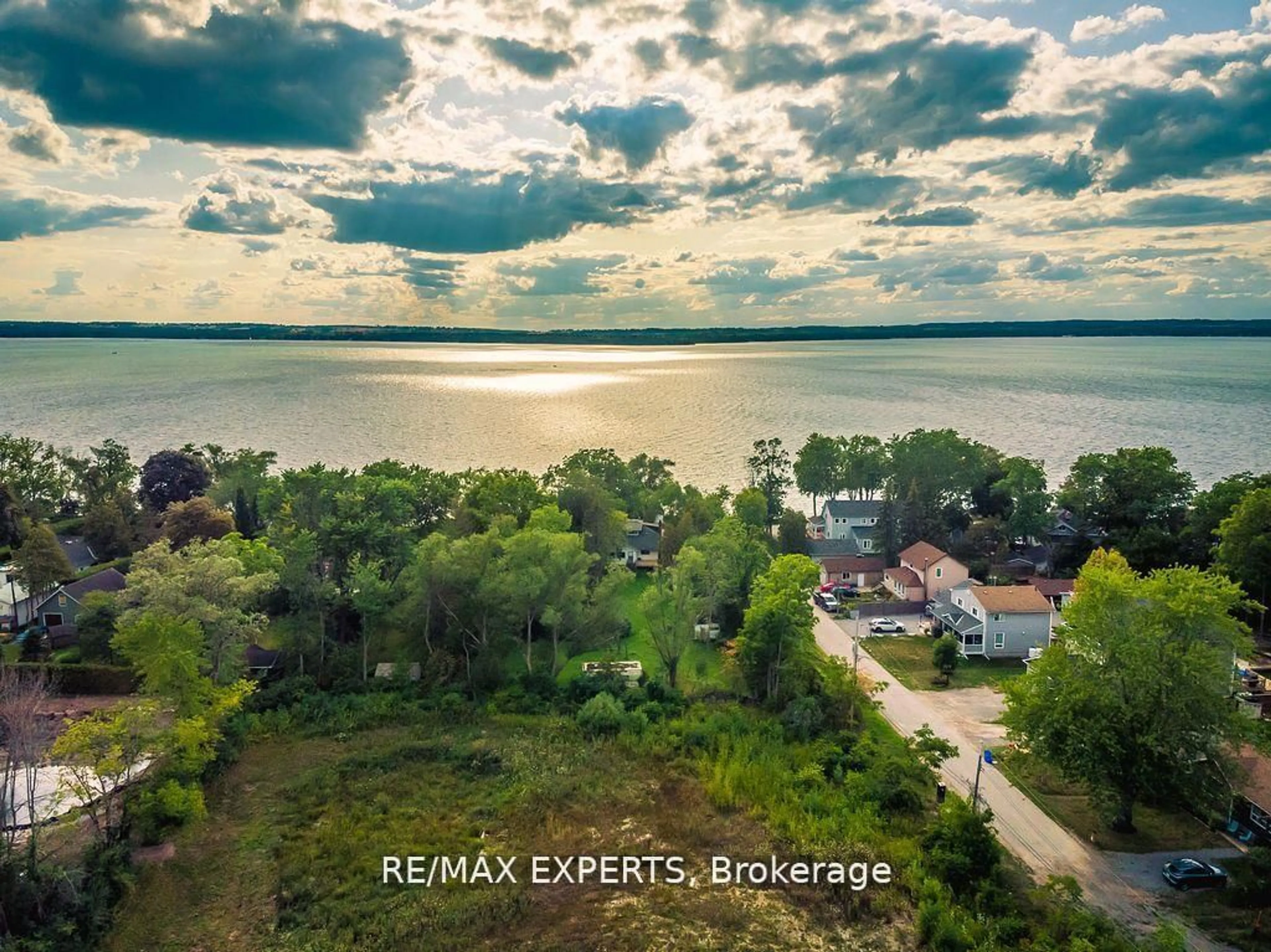 A pic from outside/outdoor area/front of a property/back of a property/a pic from drone, water/lake/river/ocean view for 300 Metro Rd, Georgina Ontario L4P 3C8