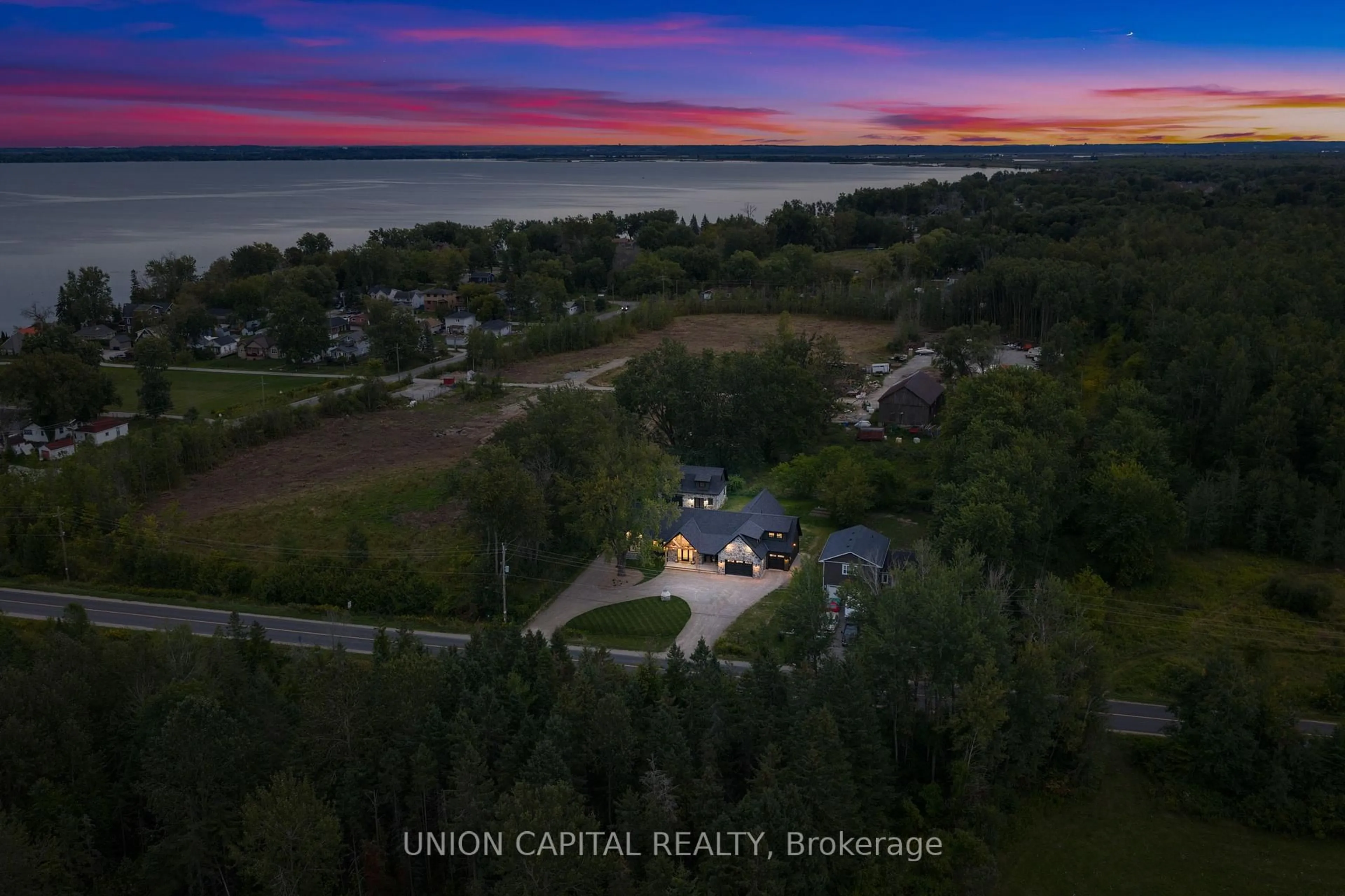 A pic from outside/outdoor area/front of a property/back of a property/a pic from drone, water/lake/river/ocean view for 1109 2nd Line, Innisfil Ontario L0L 1K0