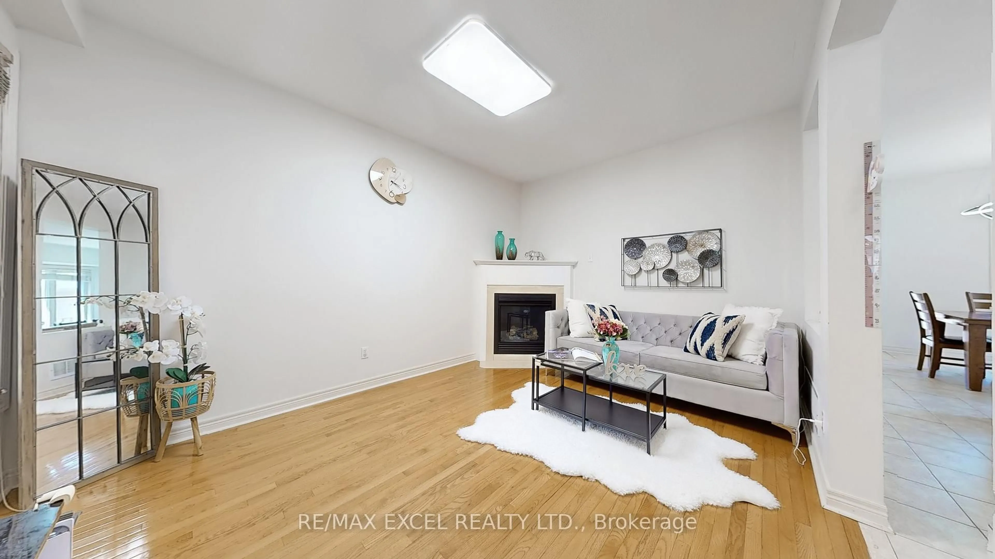 Living room with furniture, wood/laminate floor for 809 Cornell Rouge Blvd, Markham Ontario L6B 0K5