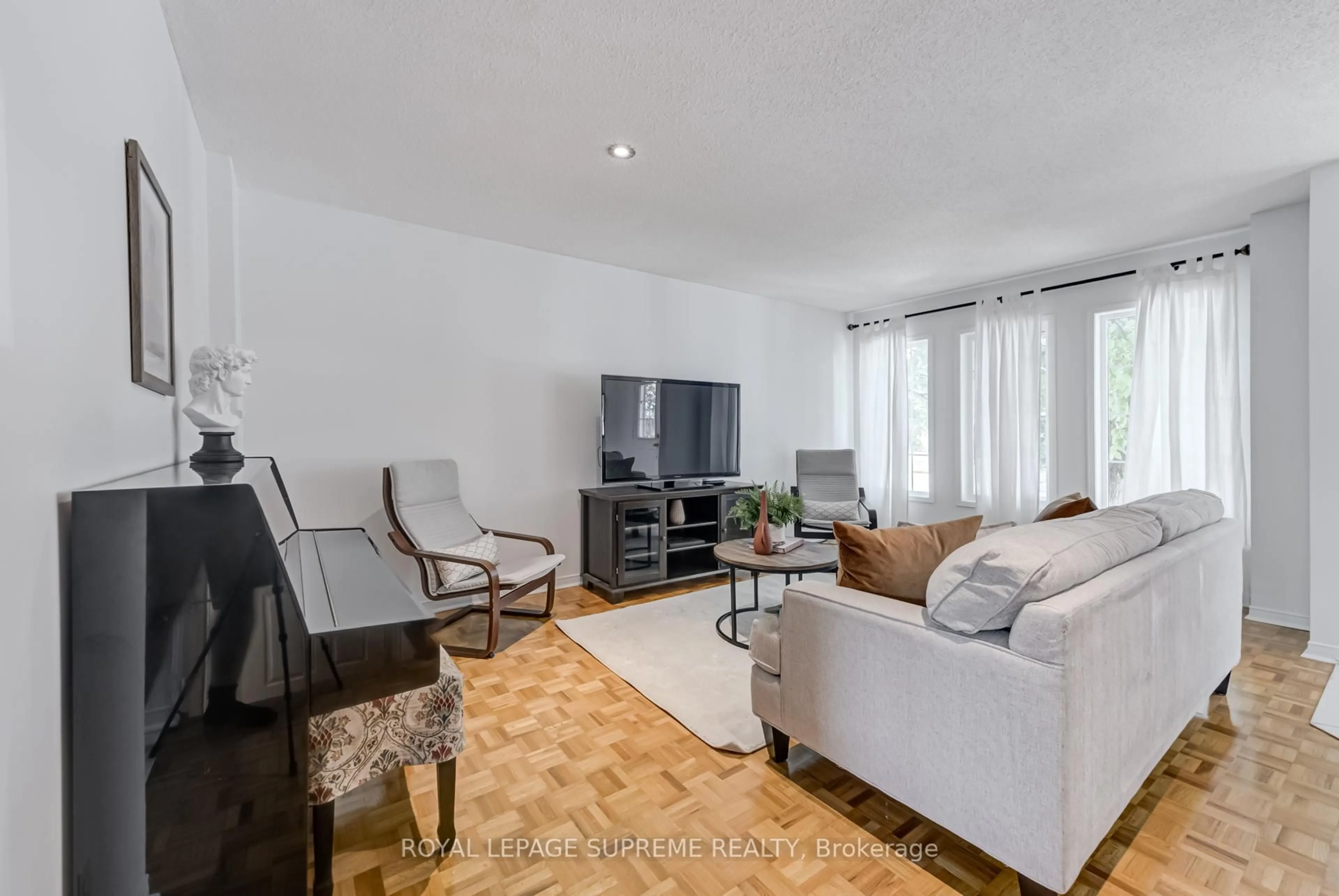 Living room with furniture, wood/laminate floor for 594 Napa Valley Ave, Vaughan Ontario L4H 1R1