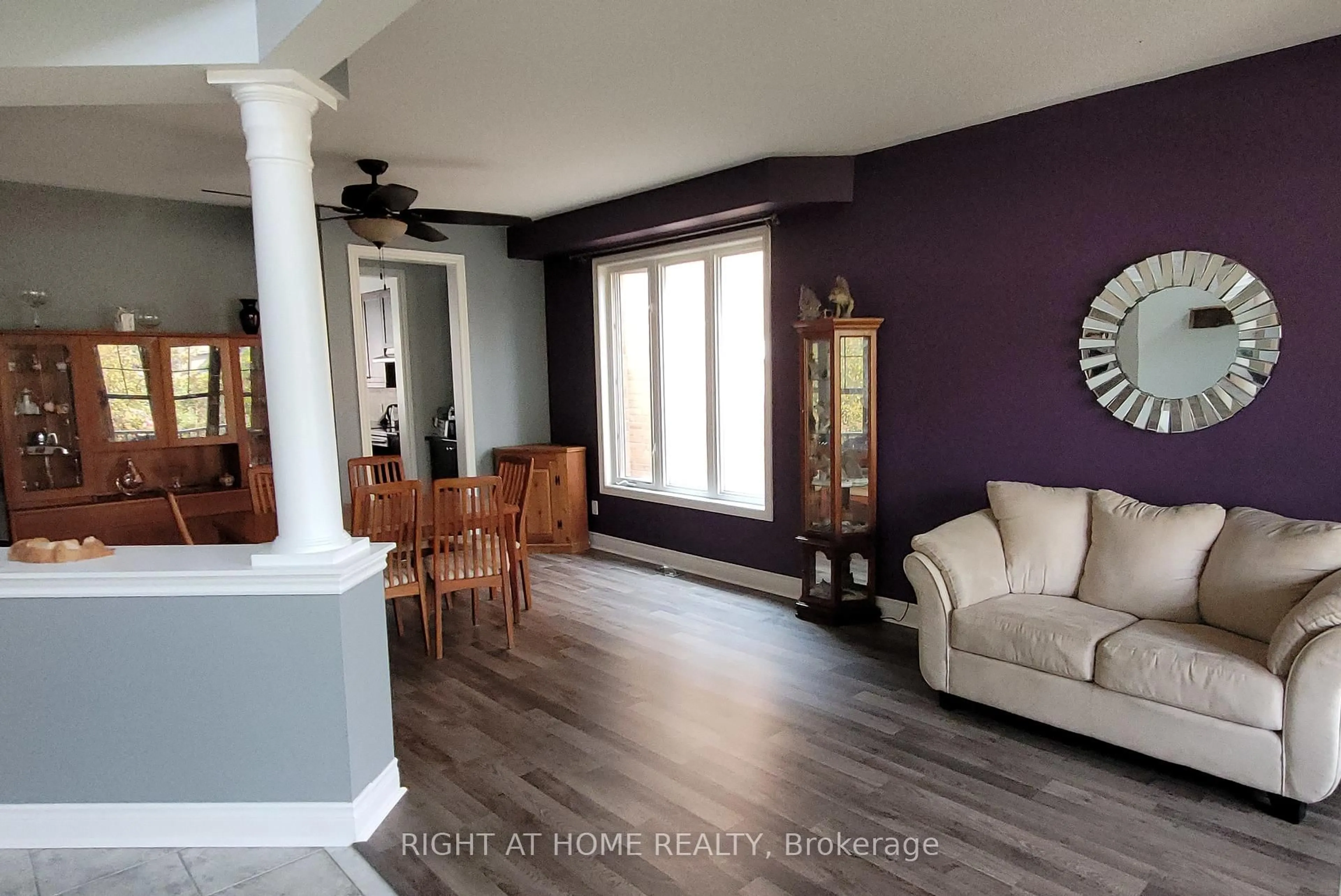 Living room with furniture, wood/laminate floor for 11 Mason Dr, New Tecumseth Ontario L9R 0M1