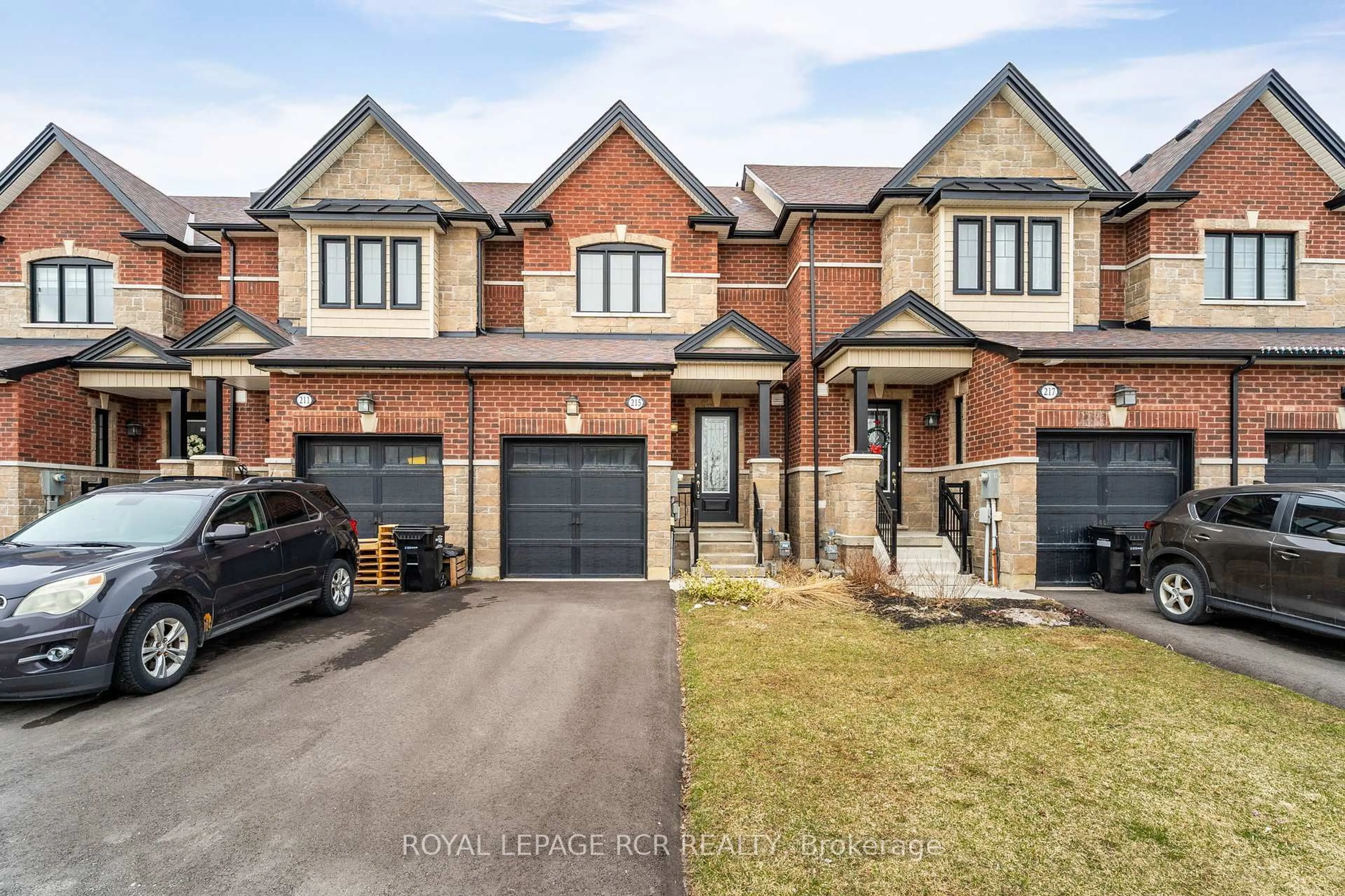 Home with brick exterior material, street for 215 Walker Blvd, New Tecumseth Ontario L9R 0R2