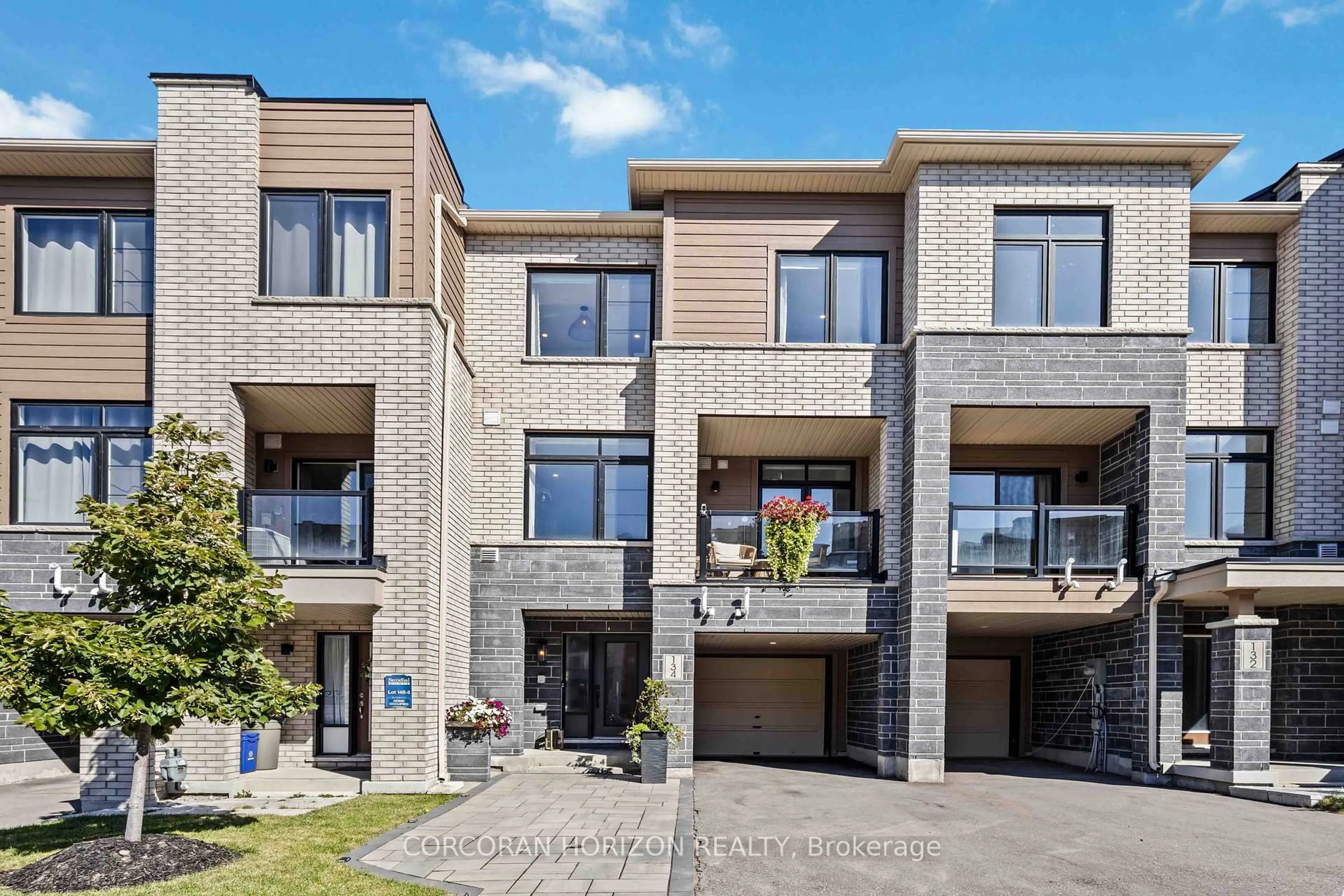 Home with brick exterior material, street for 134 Bravo Lane, Newmarket Ontario L3X 0L2