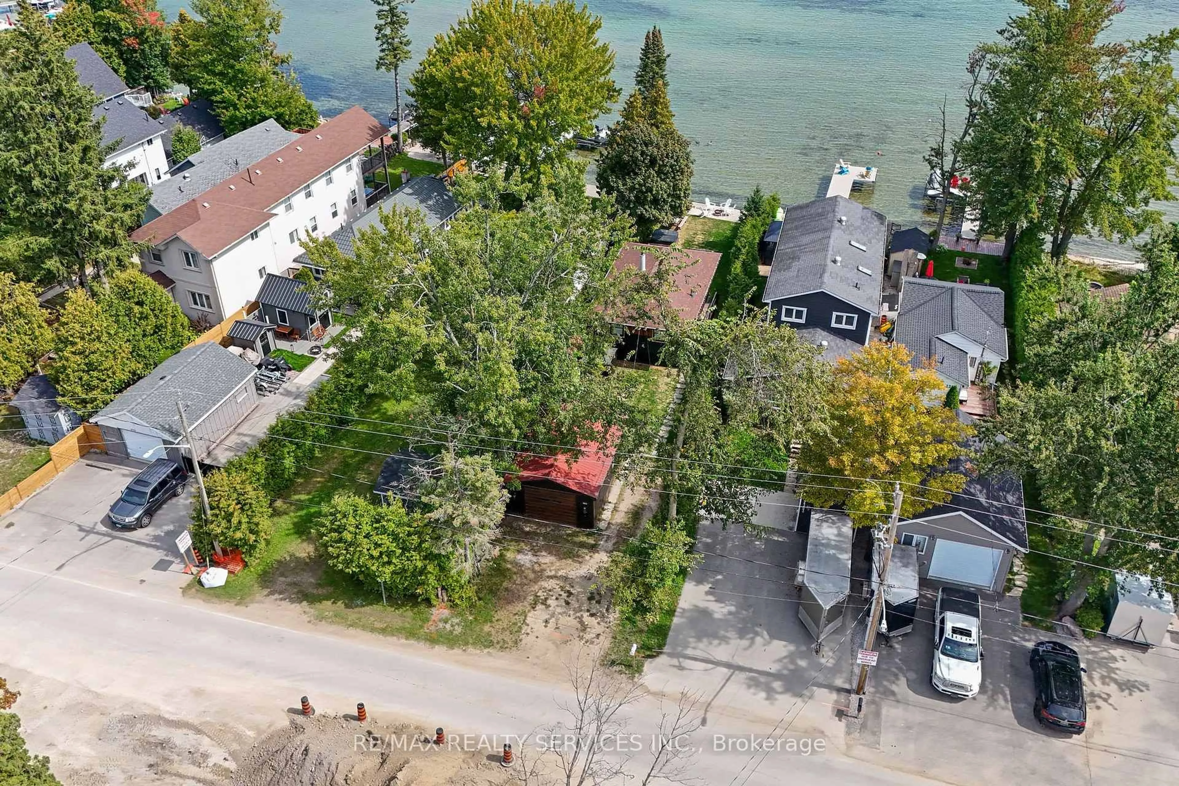 A pic from outside/outdoor area/front of a property/back of a property/a pic from drone, water/lake/river/ocean view for 2305 Crystal Beach Rd, Innisfil Ontario L9S 3W8