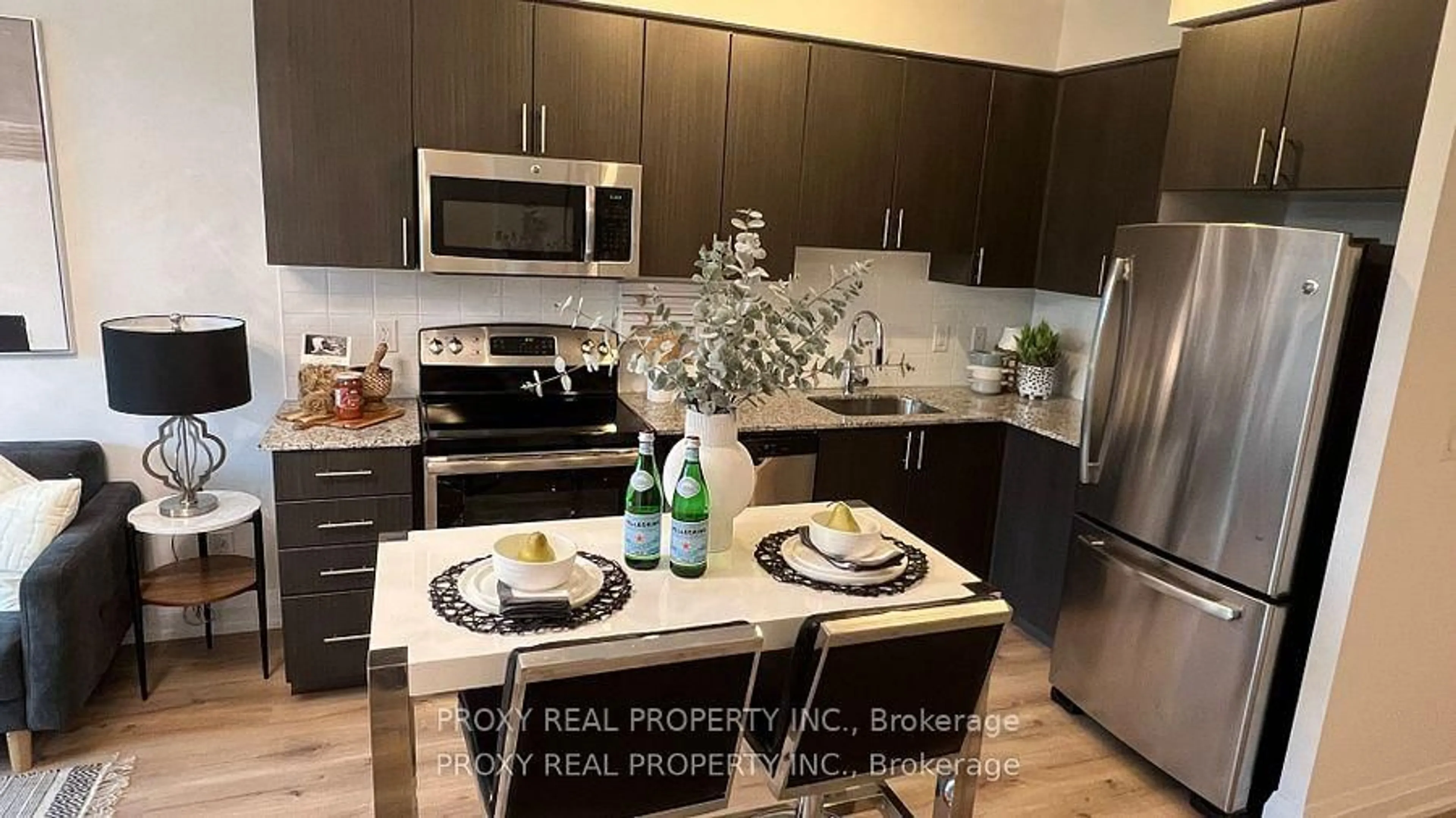 Open concept kitchen, wood/laminate floor for 7165 Yonge St #215, Markham Ontario L3T 0C9