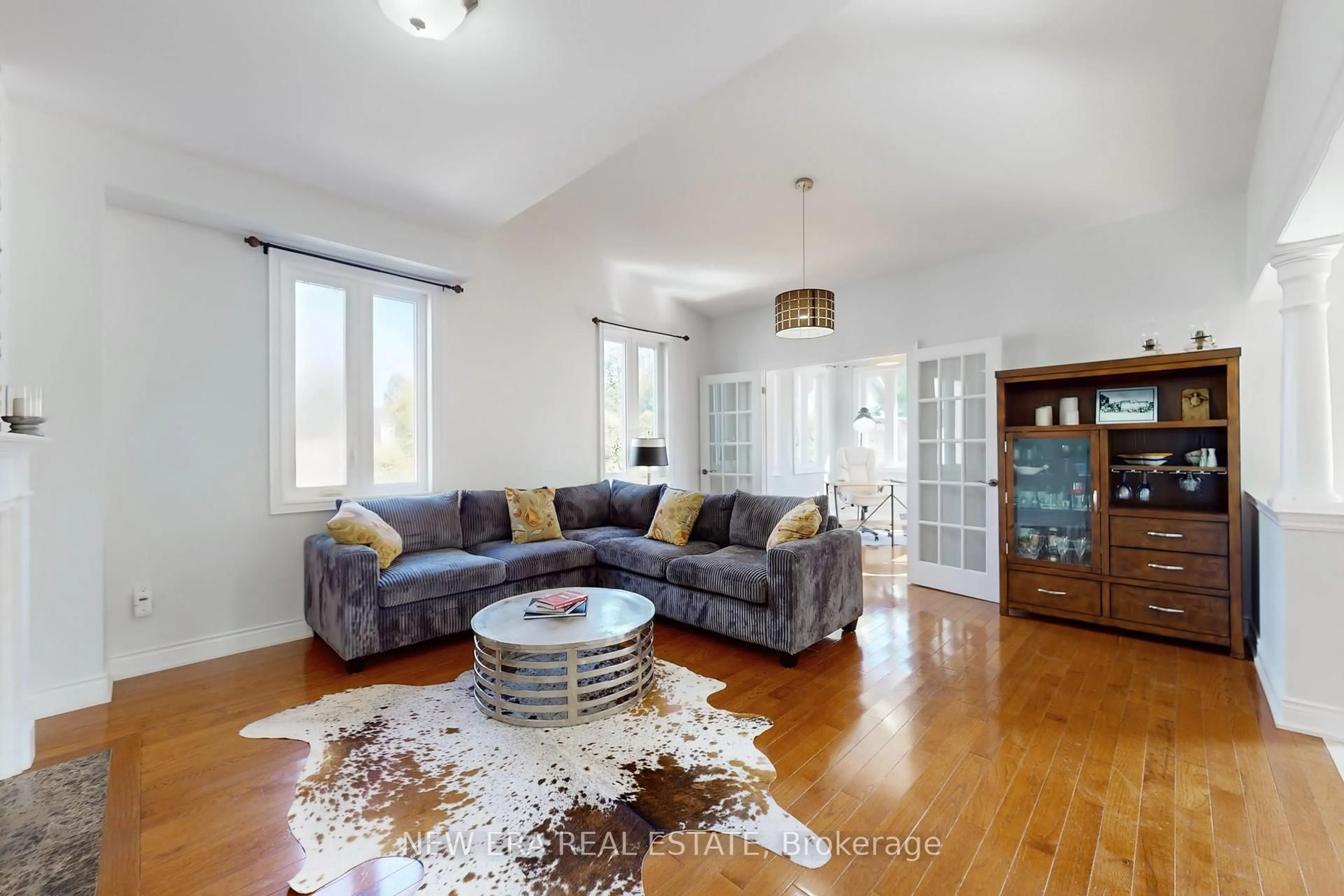Living room with furniture, wood/laminate floor for 1031 Lake Dr, Georgina Ontario L4P 3E9