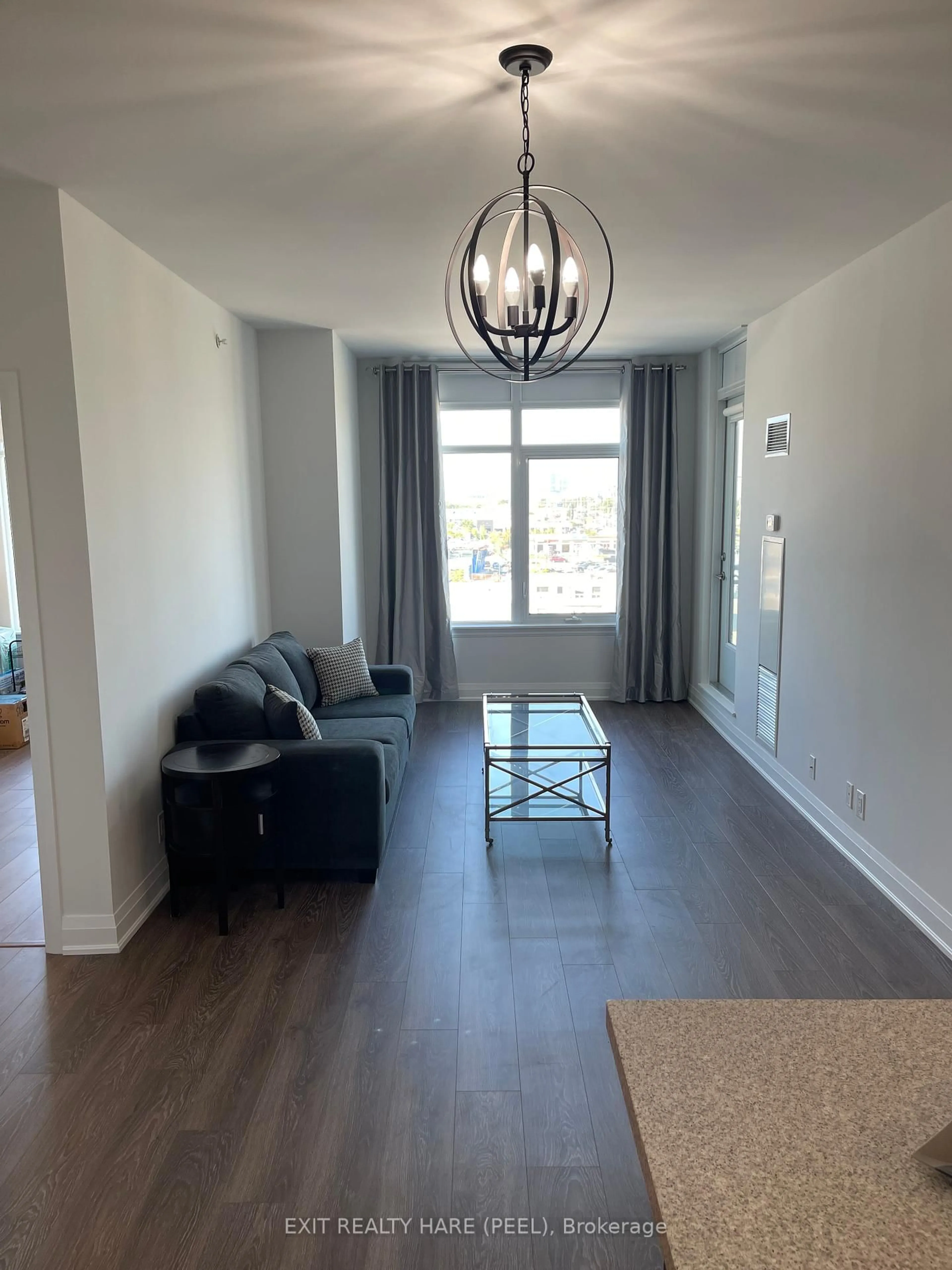 Living room with furniture, wood/laminate floor for 12 Woodstream Blvd #706, Vaughan Ontario L4L 8C3