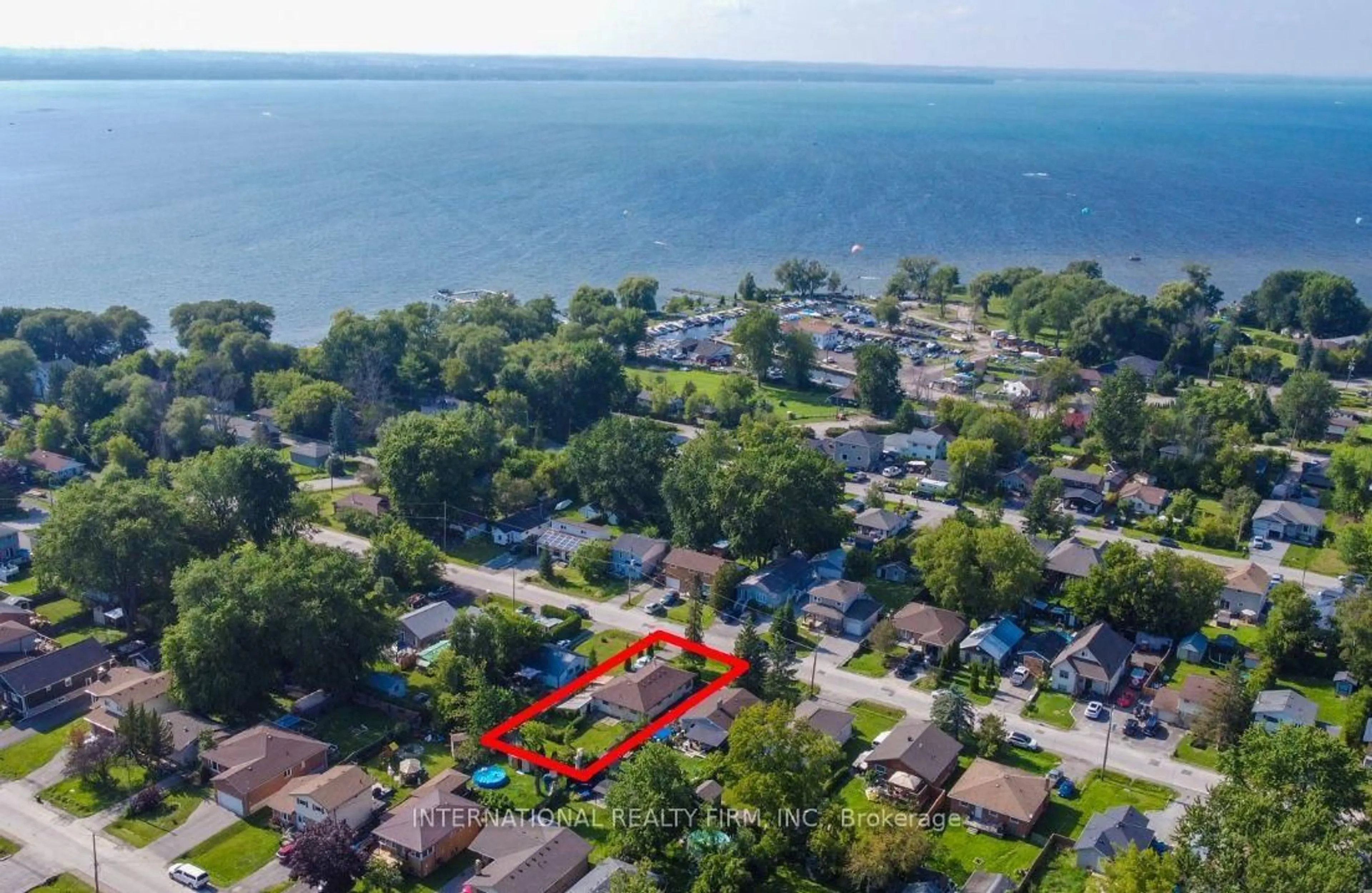 A pic from outside/outdoor area/front of a property/back of a property/a pic from drone, water/lake/river/ocean view for 355 Hollywood Dr, Georgina Ontario L4P 3A2