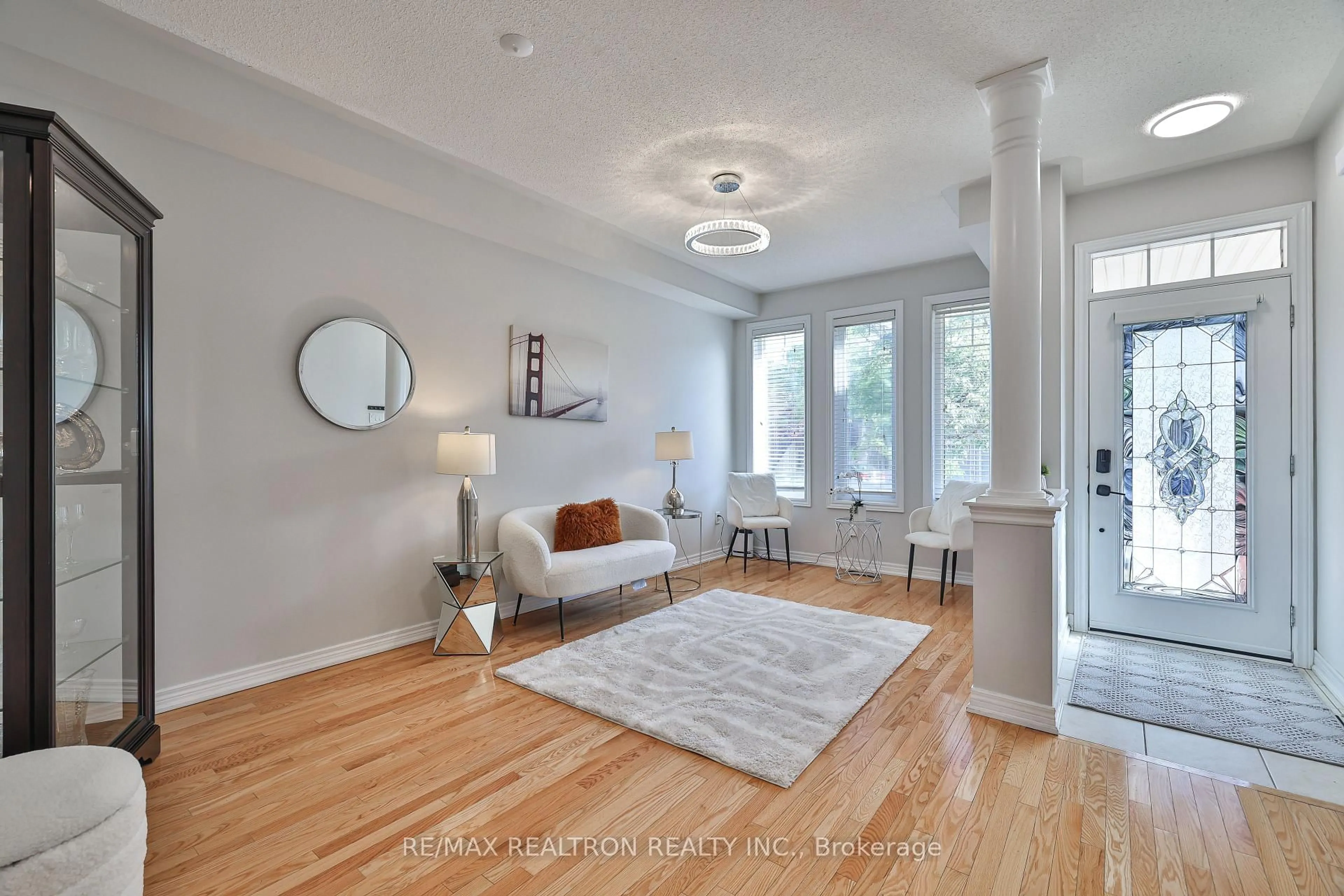 Living room with furniture, wood/laminate floor for 55 Stookes Cres, Richmond Hill Ontario L4E 0J4