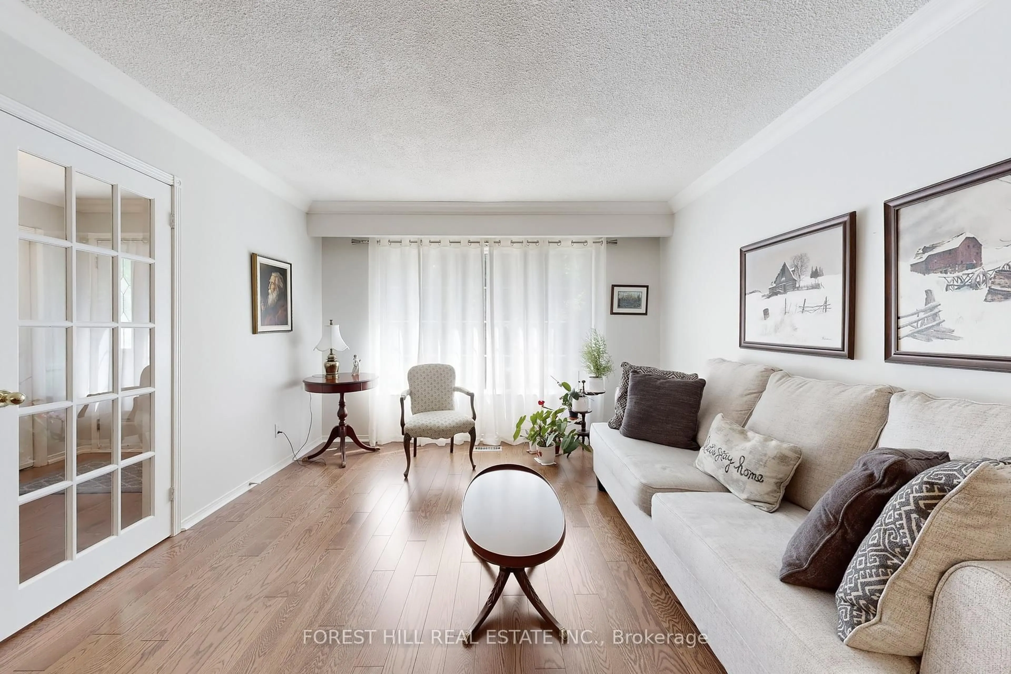 Living room with furniture, wood/laminate floor for 20 Thurgate Cres, Markham Ontario L3T 4G3