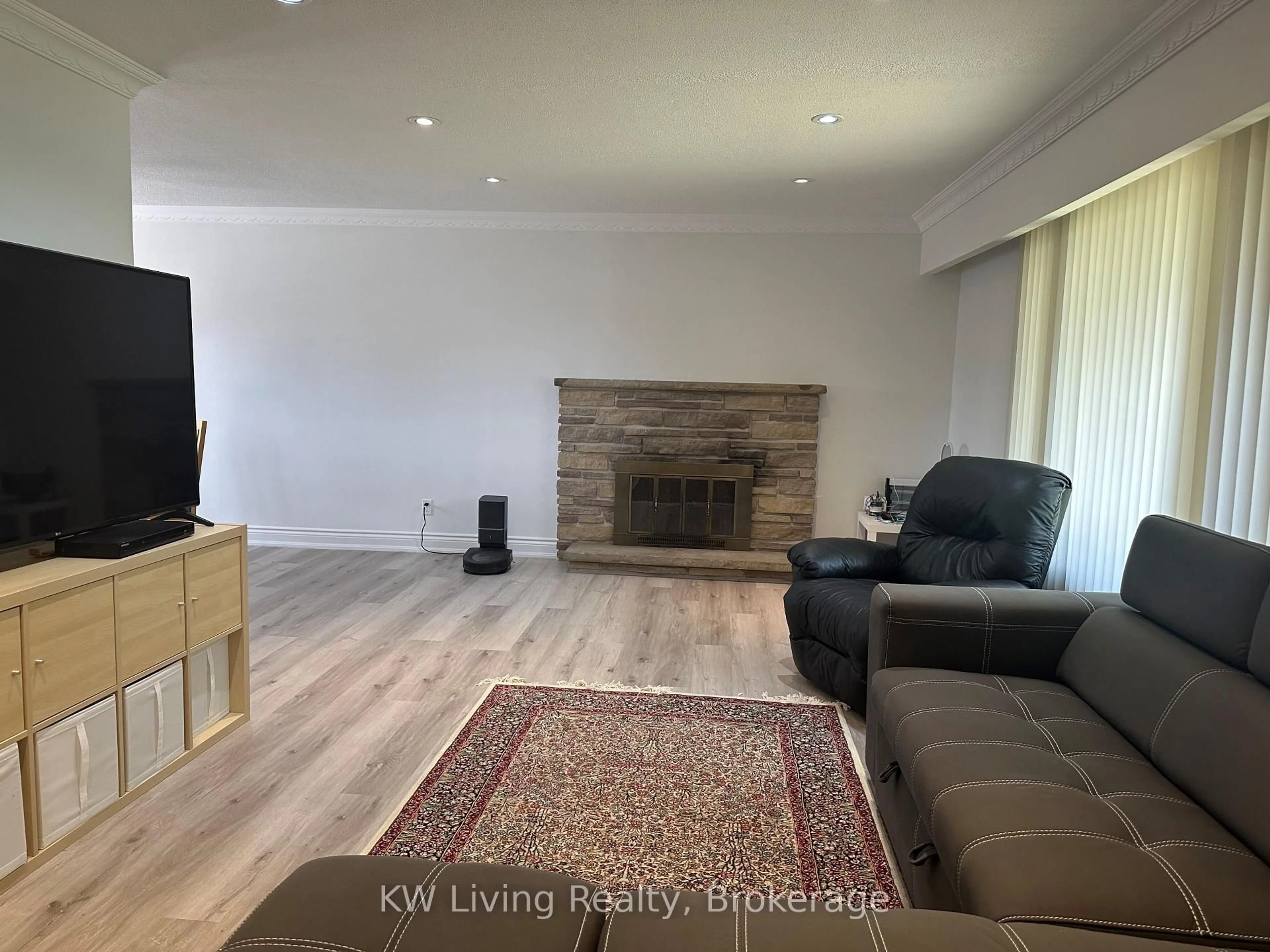 Living room with furniture, wood/laminate floor for 702 Lake Dr, Georgina Ontario L4P 1V1