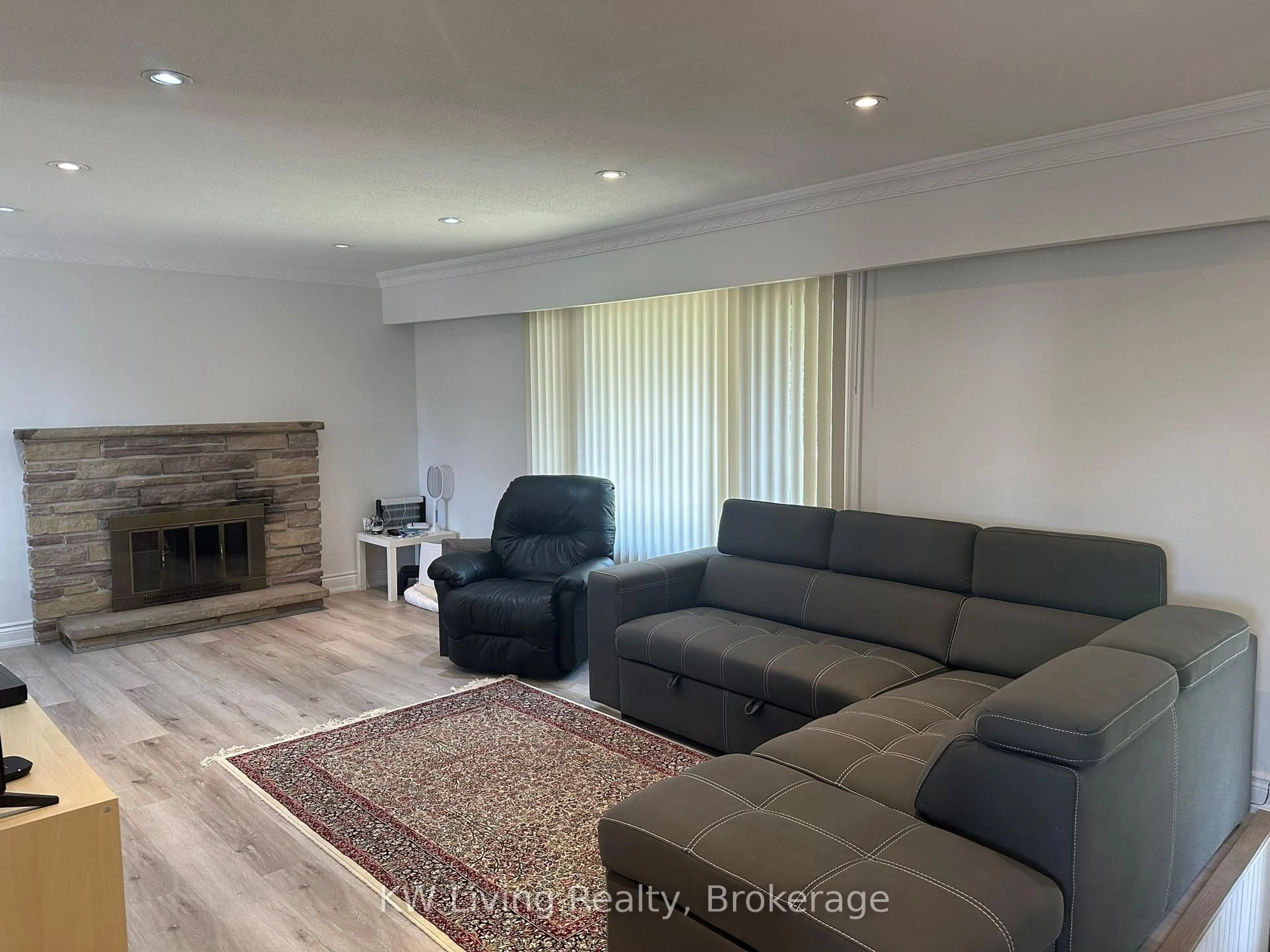 Living room with furniture, wood/laminate floor for 702 Lake Dr, Georgina Ontario L4P 1V1