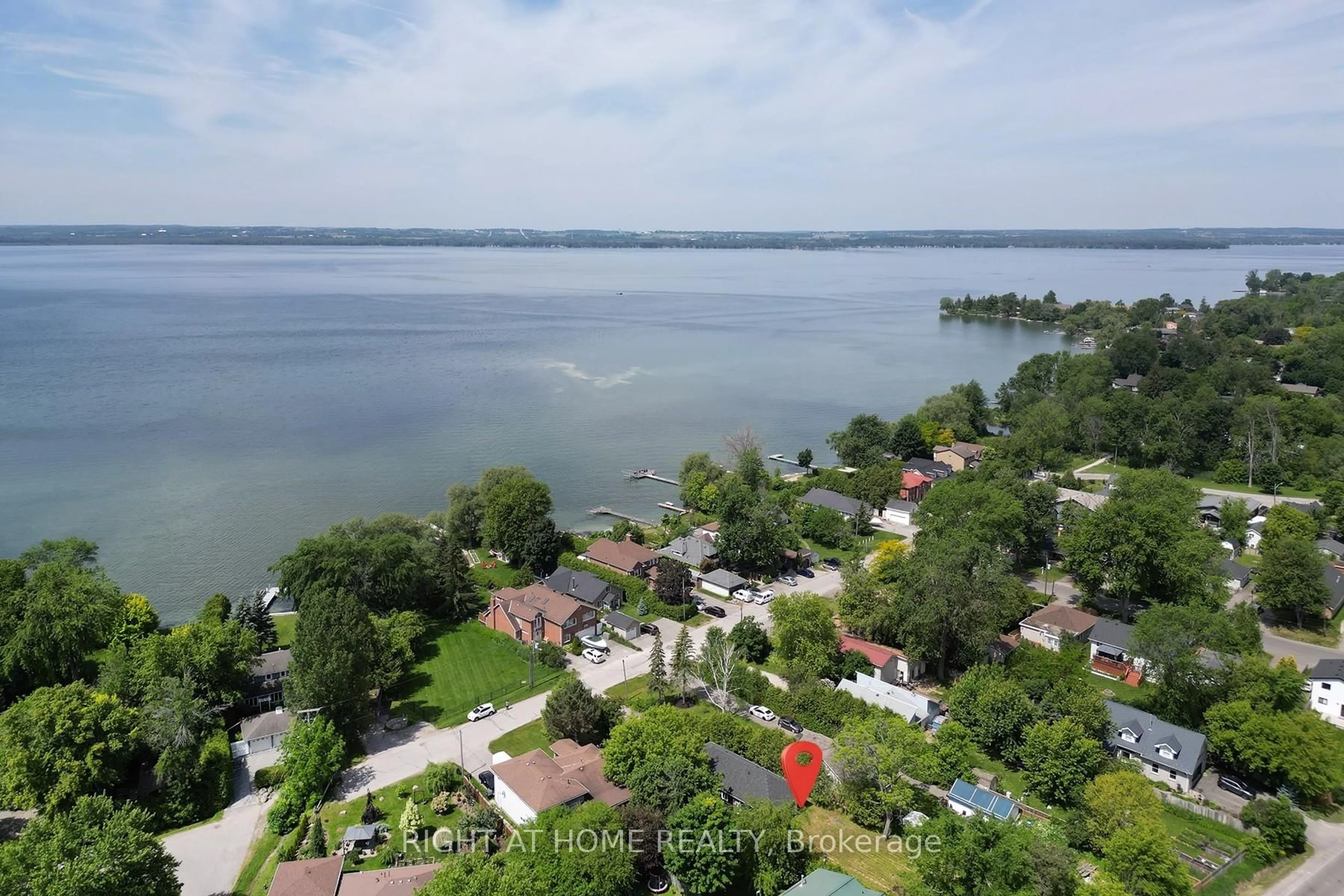 A pic from outside/outdoor area/front of a property/back of a property/a pic from drone, water/lake/river/ocean view for 47 Metropolitan Cres, Georgina Ontario L4P 1L7
