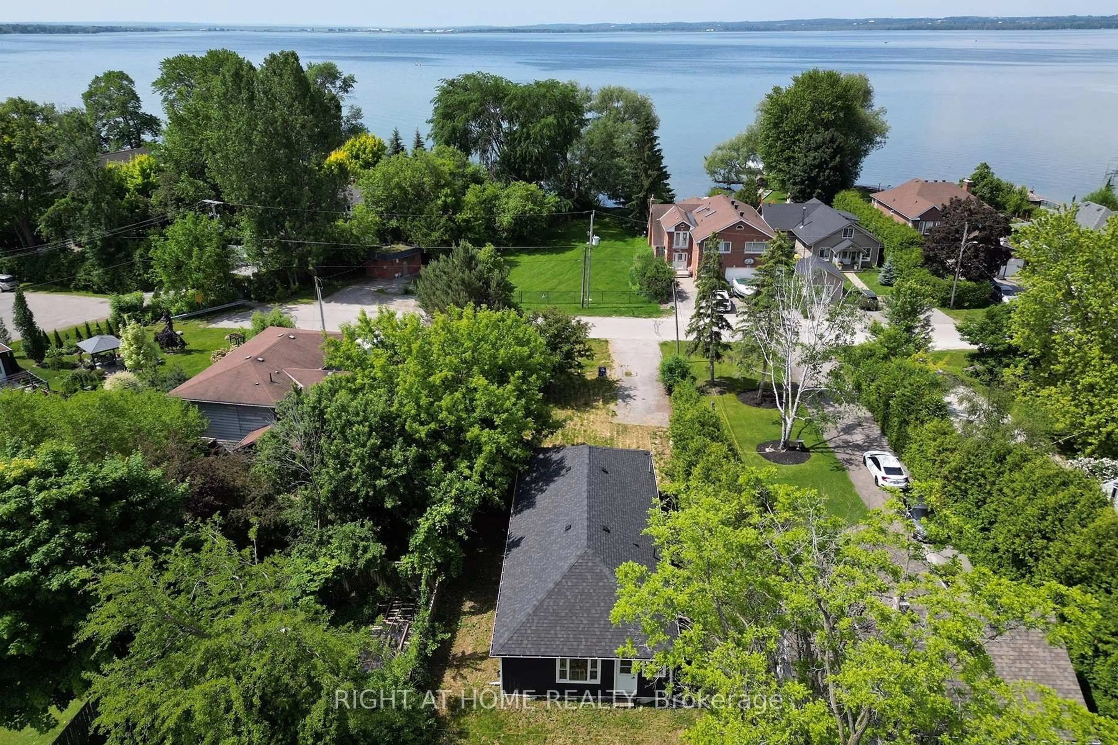 A pic from outside/outdoor area/front of a property/back of a property/a pic from drone, water/lake/river/ocean view for 47 Metropolitan Cres, Georgina Ontario L4P 1L7