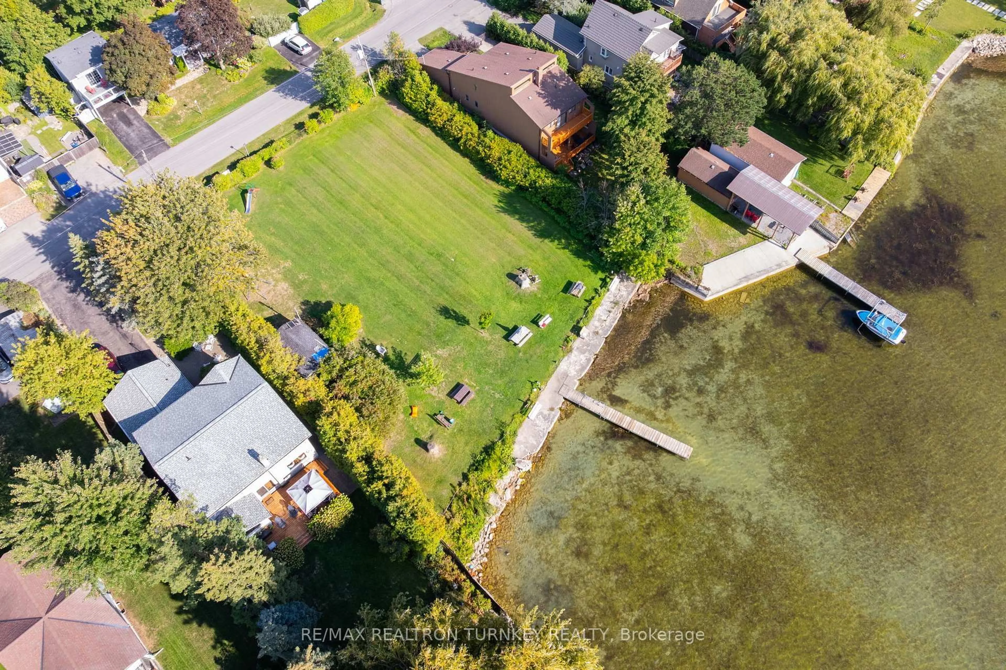 A pic from outside/outdoor area/front of a property/back of a property/a pic from drone, water/lake/river/ocean view for 137 Cooks Bay Dr, Georgina Ontario L4P 2M2