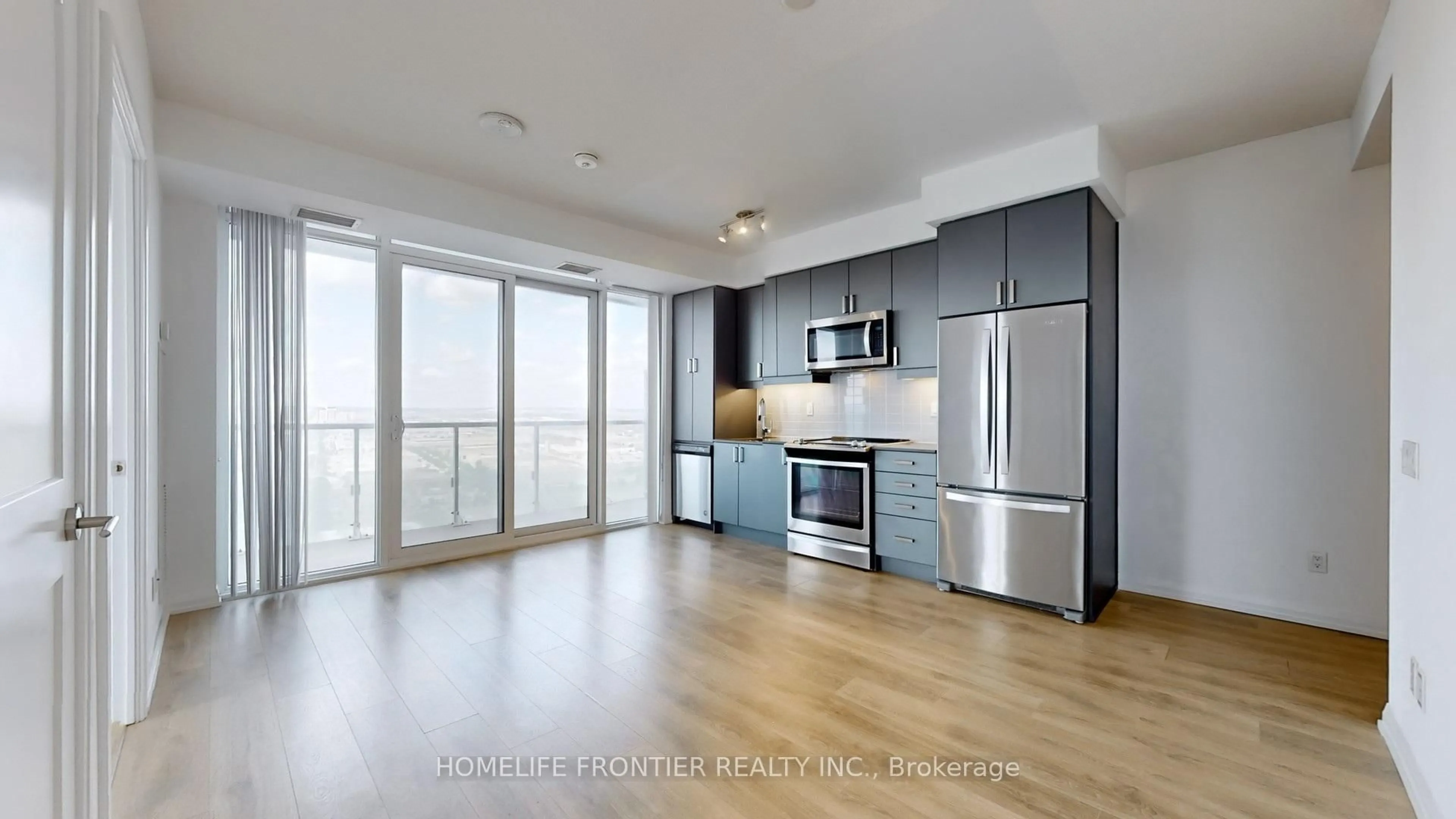 Open concept kitchen, wood/laminate floor for 7895 Jane St #3313, Vaughan Ontario L4K 0K2
