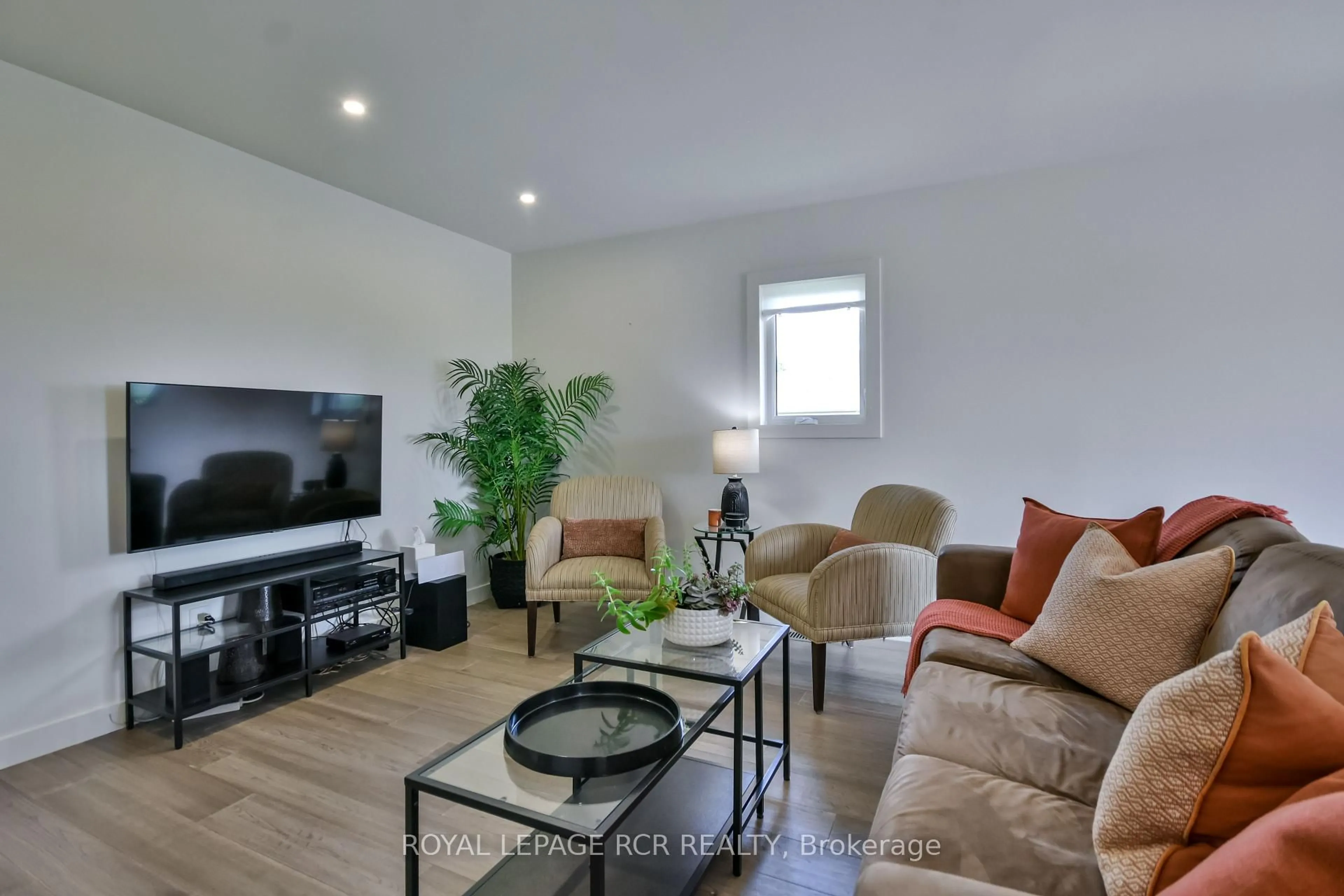 Living room with furniture, wood/laminate floor for 2075 Gilford Rd, Innisfil Ontario L0L 1R0