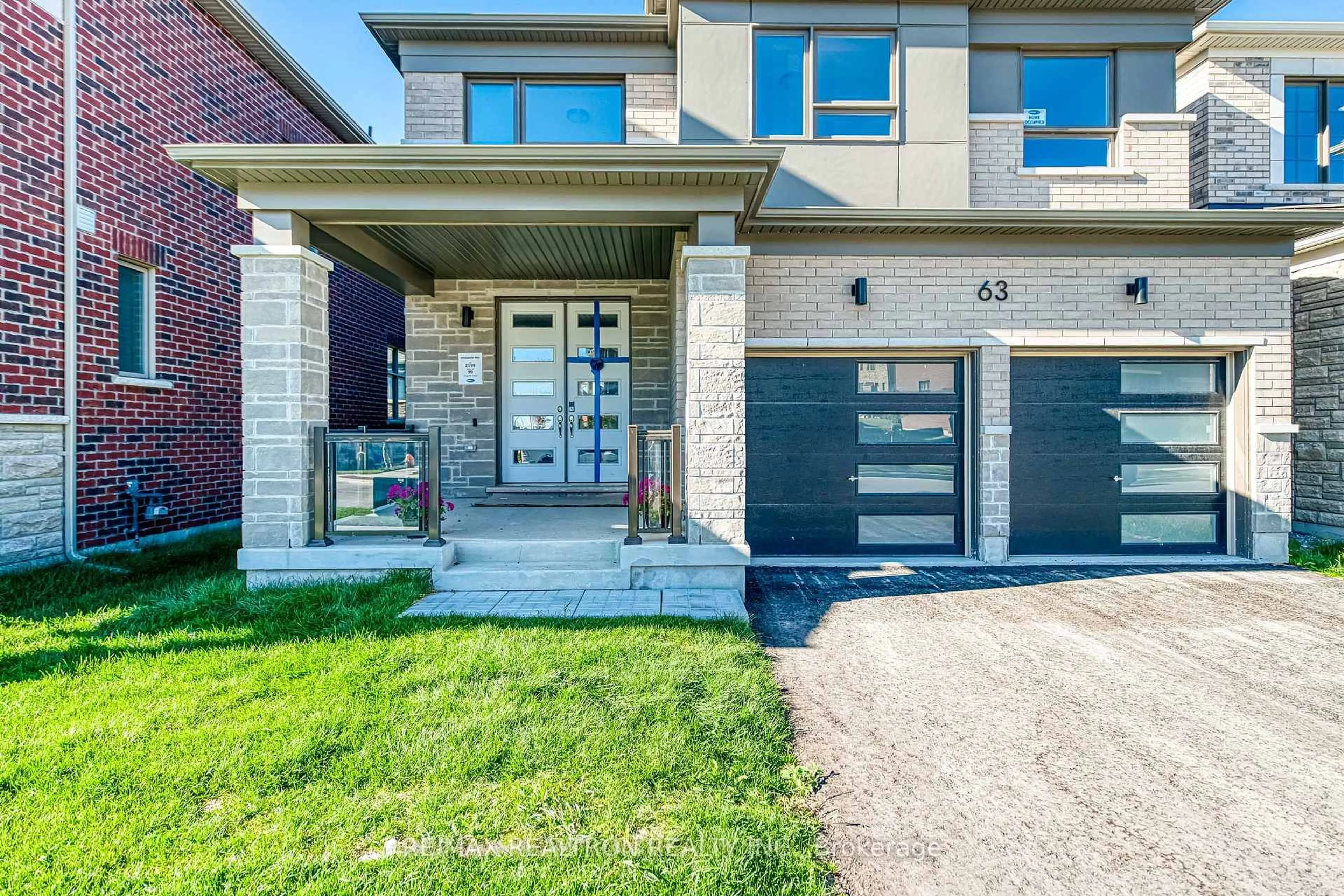 Home with brick exterior material, street for 63 Greenridge Cres, Markham Ontario L6C 3M1