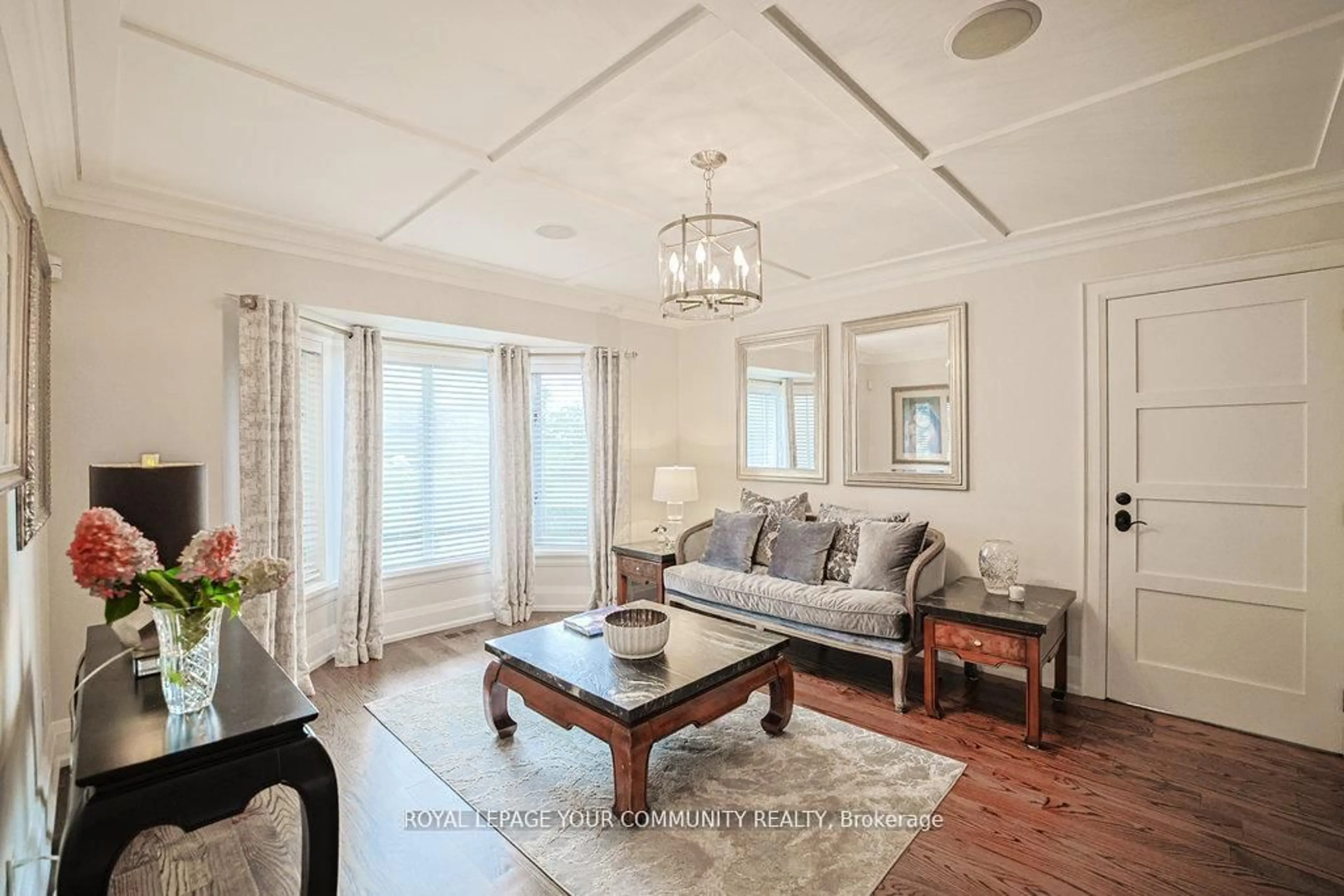 Living room with furniture, wood/laminate floor for 63 Carrying Place Tr, King Ontario L7B 0C8