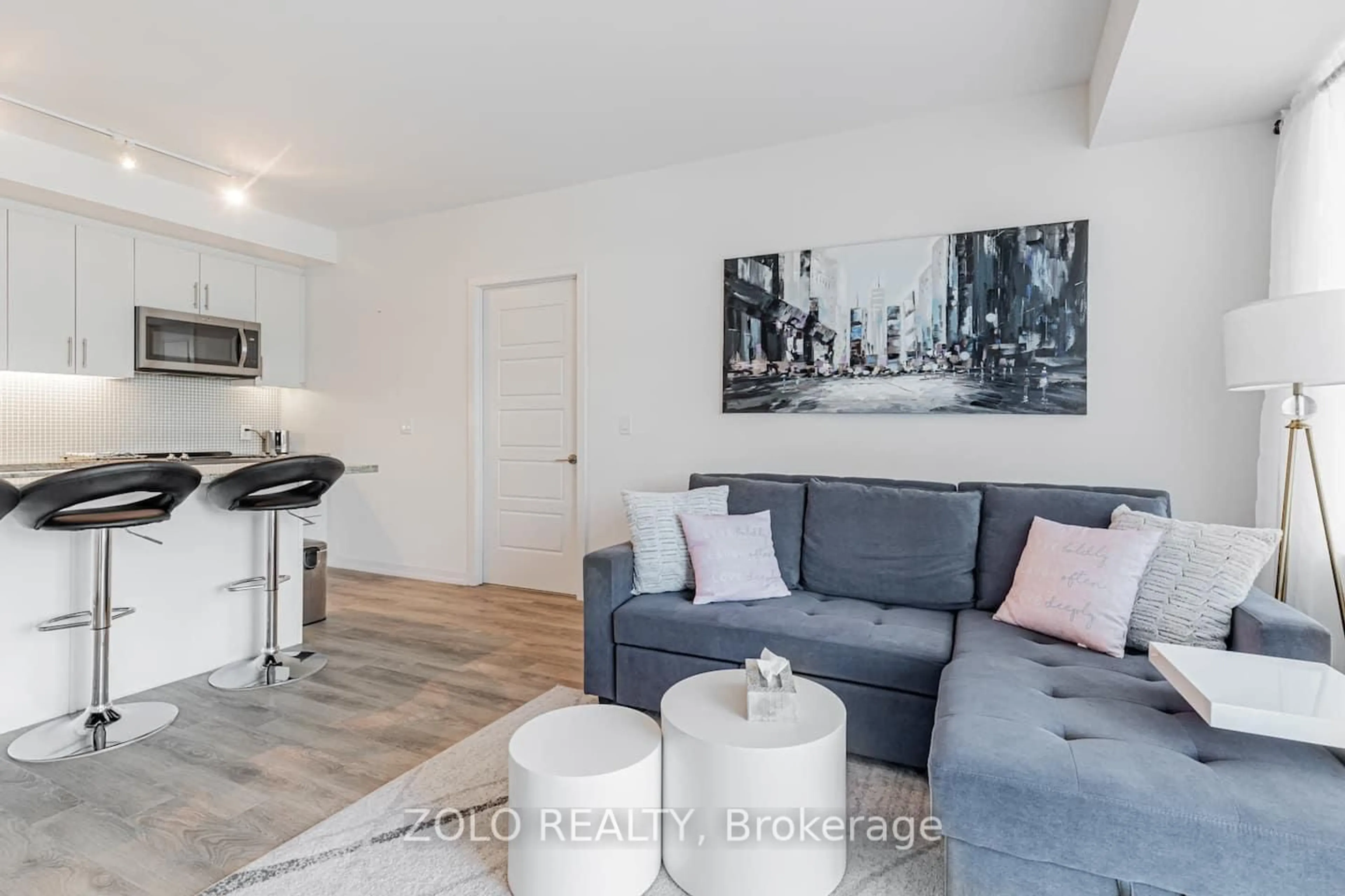 Living room with furniture, wood/laminate floor for 241 Sea Ray Ave, Innisfil Ontario L9S 0L9