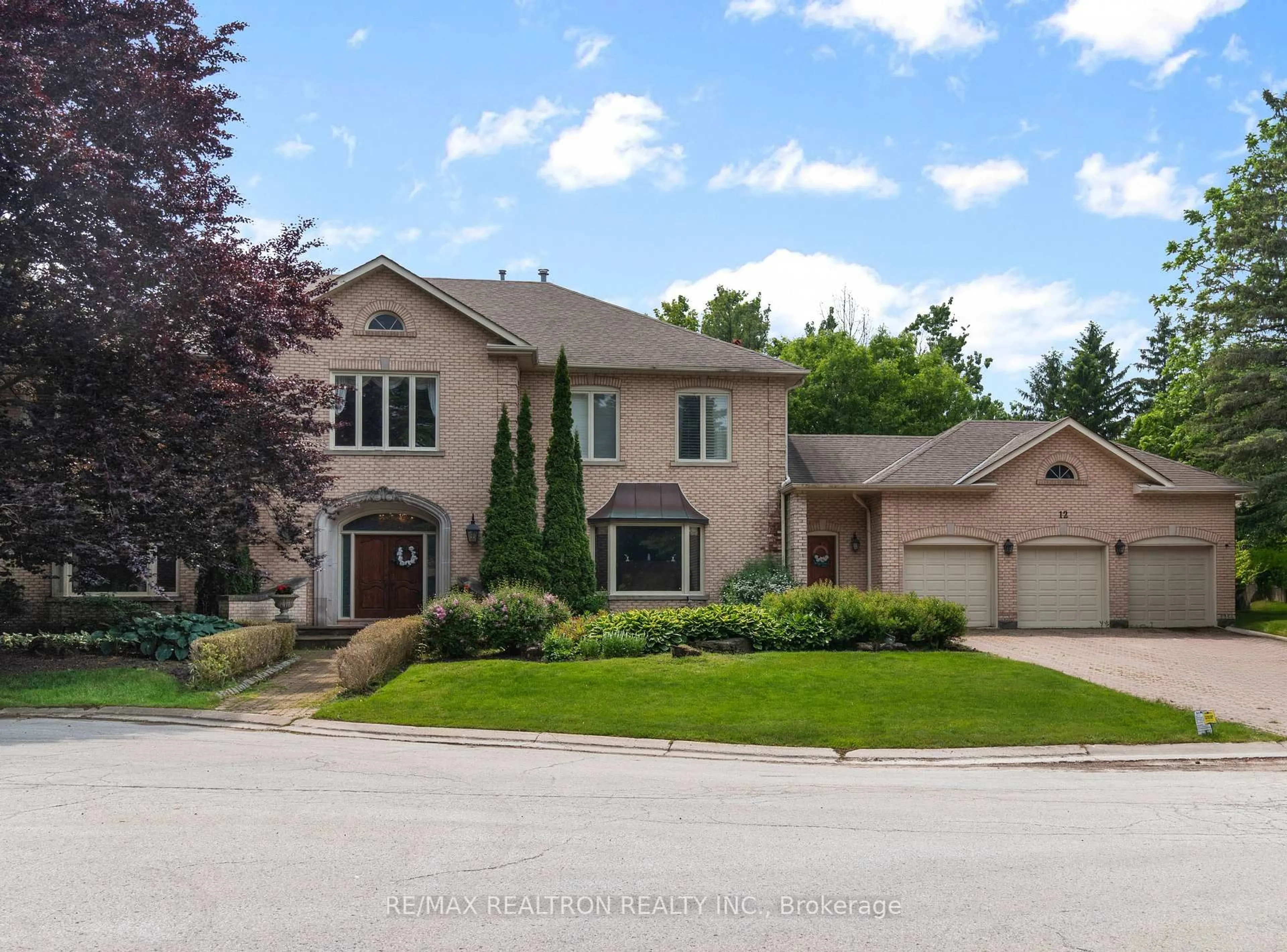 Home with brick exterior material, street for 12 Moodie Dr, Richmond Hill Ontario L4C 8C9