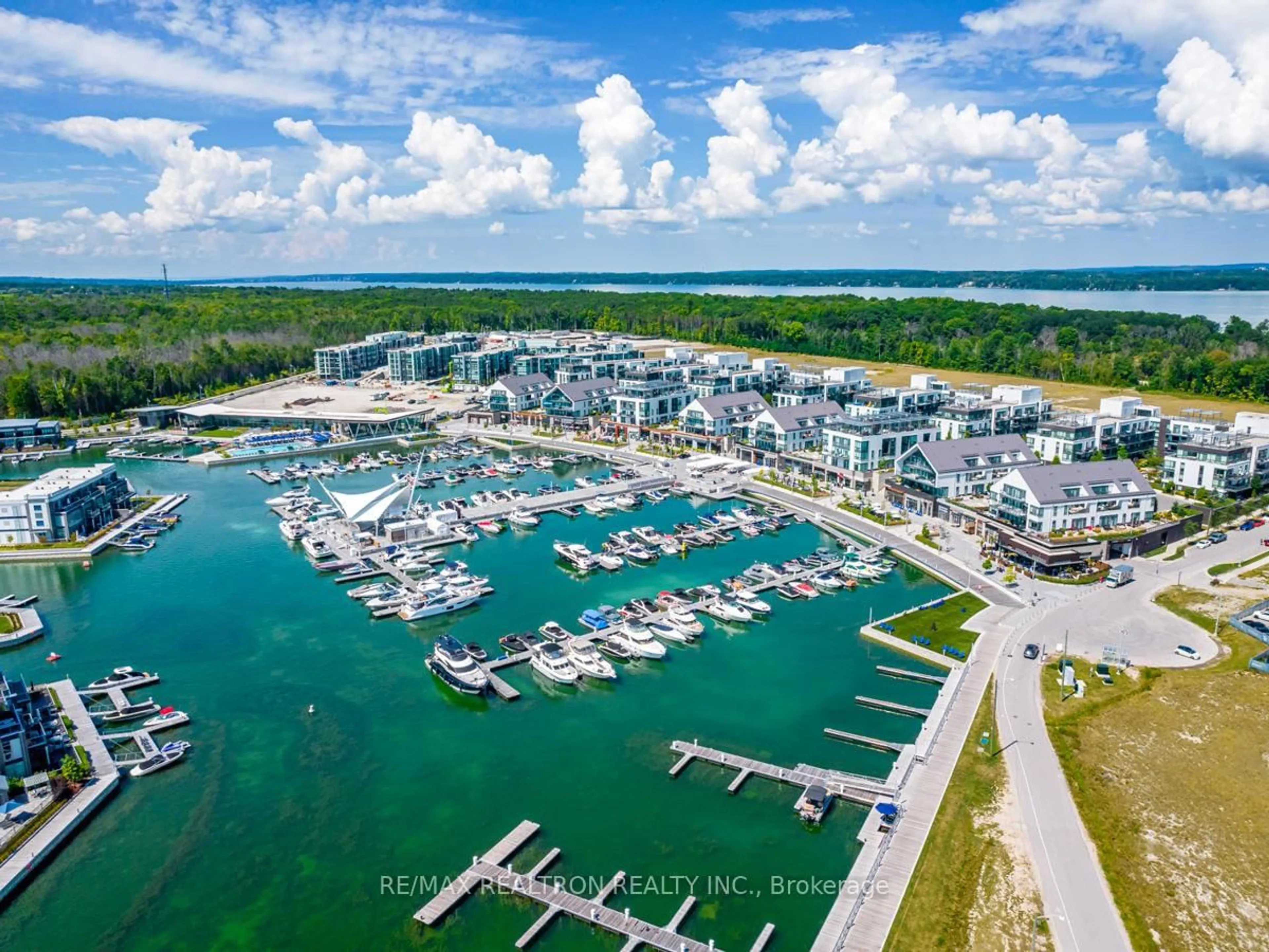 A pic from outside/outdoor area/front of a property/back of a property/a pic from drone, water/lake/river/ocean view for 301 Sea Ray Ave #C216, Innisfil Ontario L9S 0M3