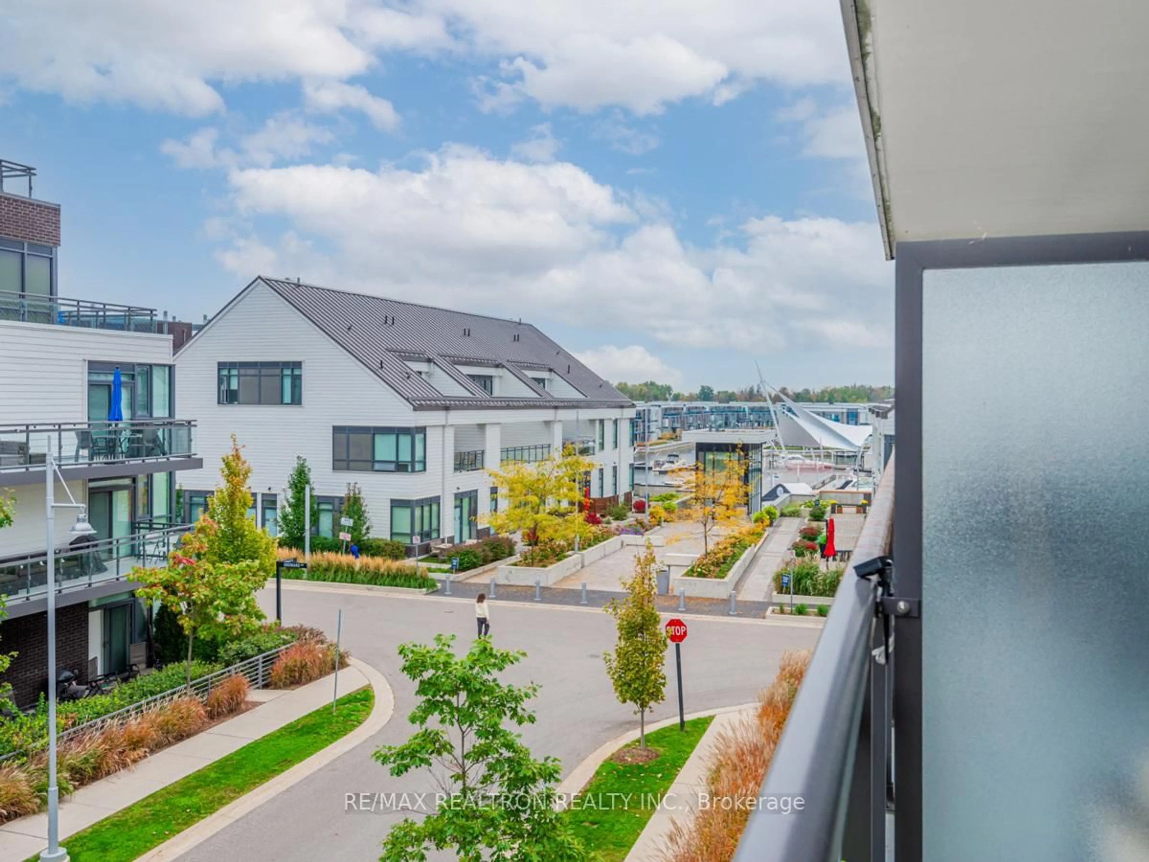 A pic from outside/outdoor area/front of a property/back of a property/a pic from drone, city buildings view from balcony for 301 Sea Ray Ave #C216, Innisfil Ontario L9S 0M3