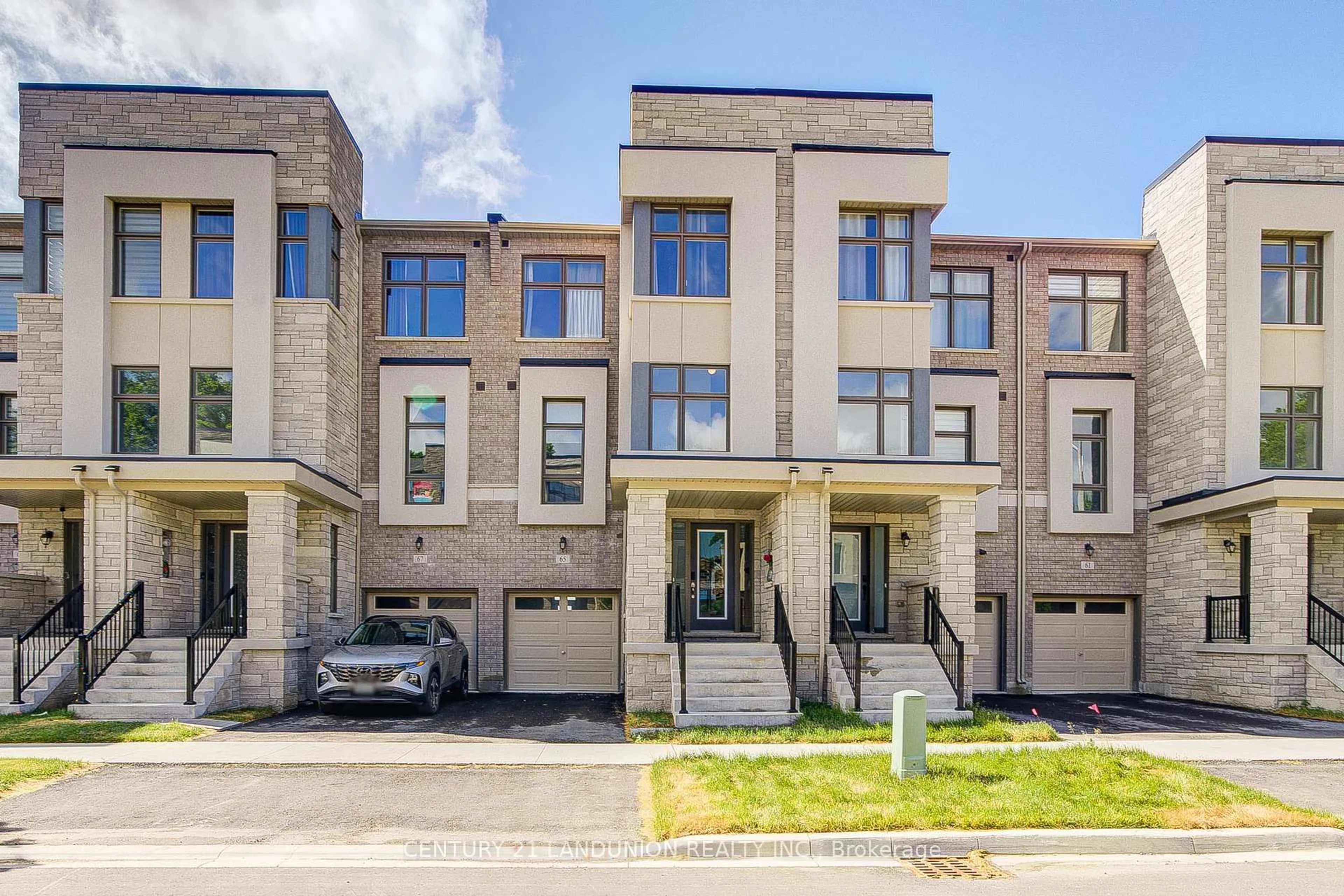 Home with brick exterior material, street for 65 Puisaya Dr, Richmond Hill Ontario L4E 1L2