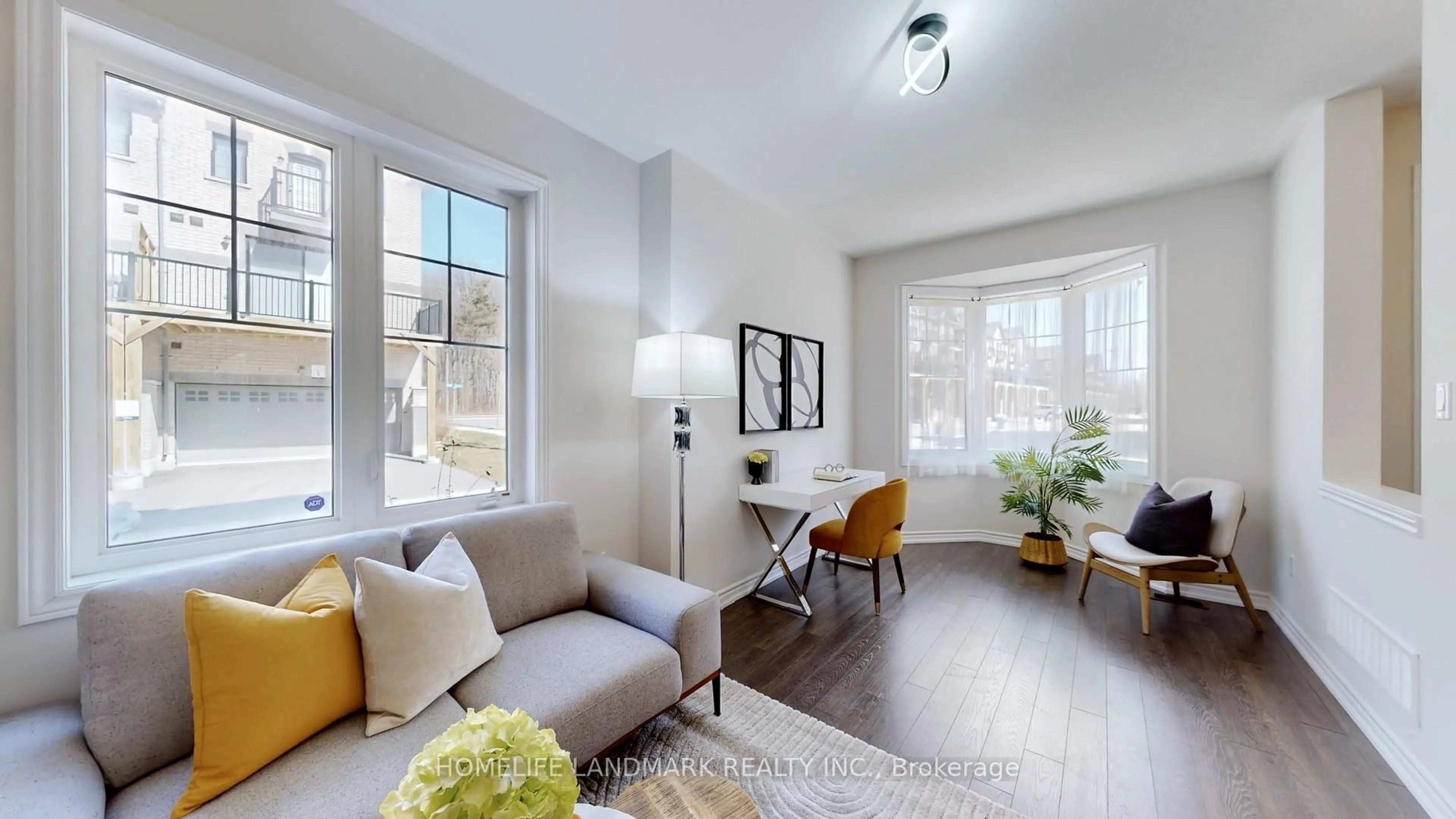 Living room with furniture, wood/laminate floor for 44 Robert Joffre Leet Ave, Markham Ontario L6B 0V2