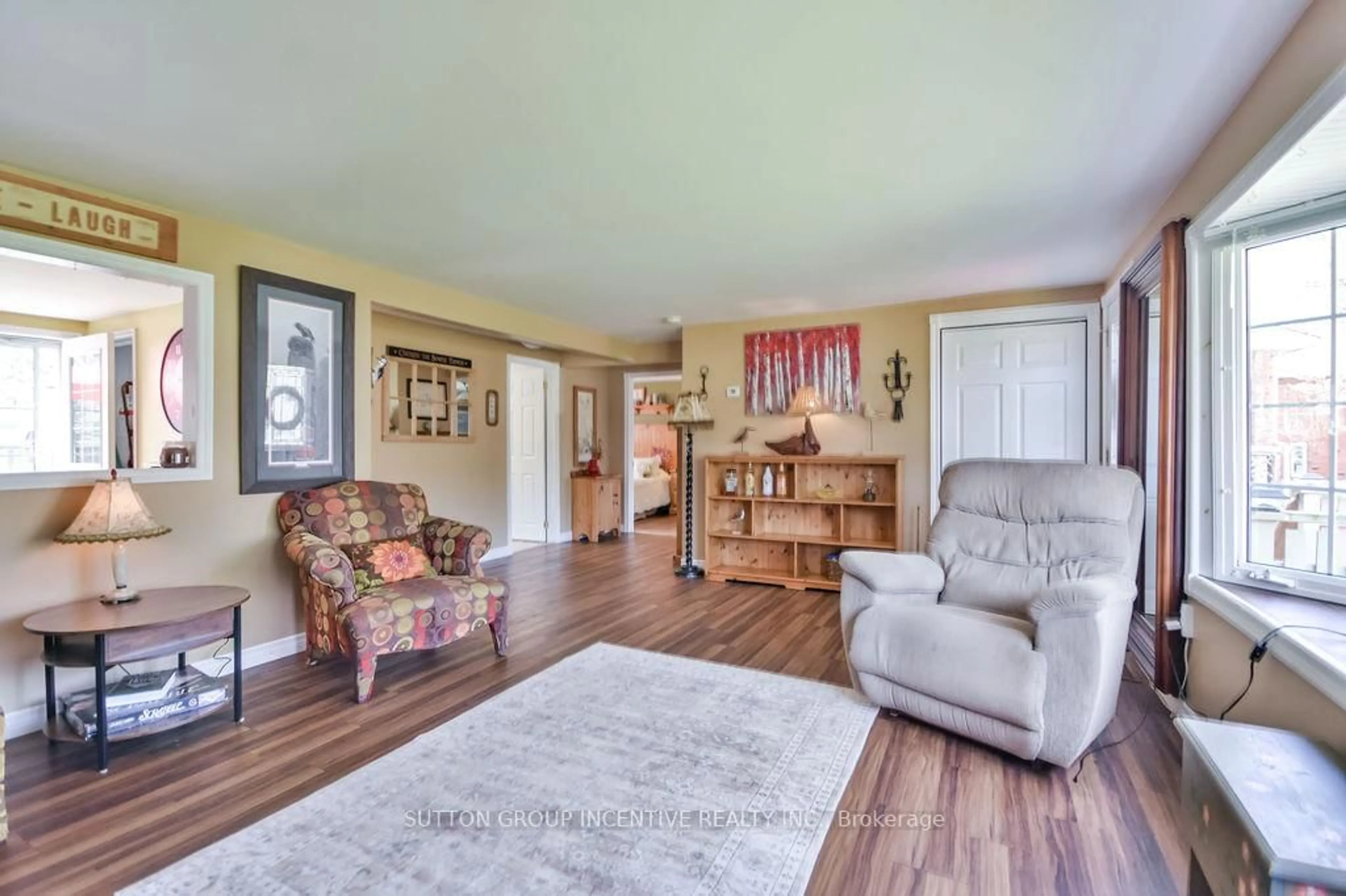 Living room with furniture, wood/laminate floor for 1057 Ferrier Ave, Innisfil Ontario L0L 1W0