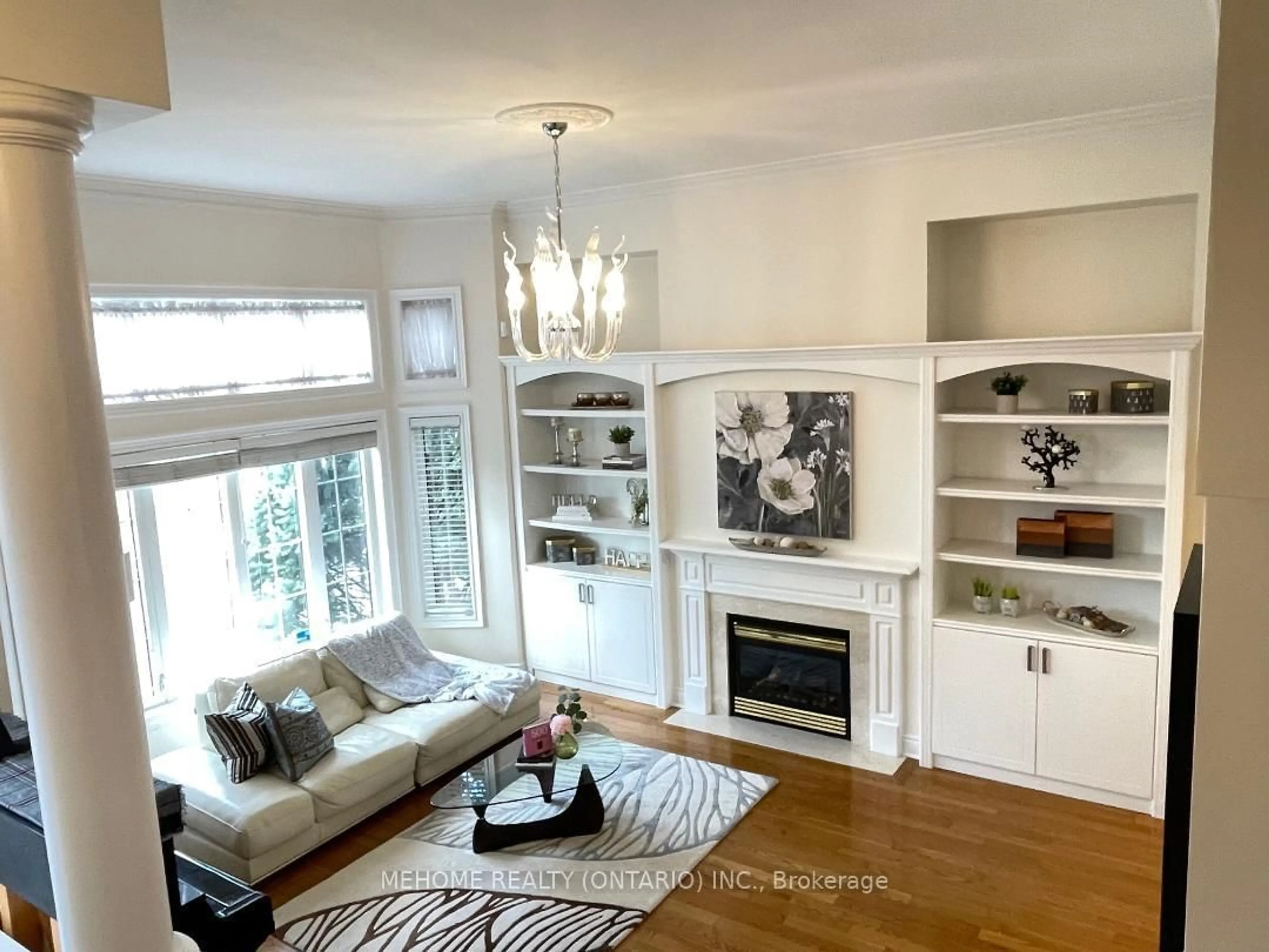 Living room with furniture, wood/laminate floor for 190 Legends Way, Markham Ontario L3R 6A9