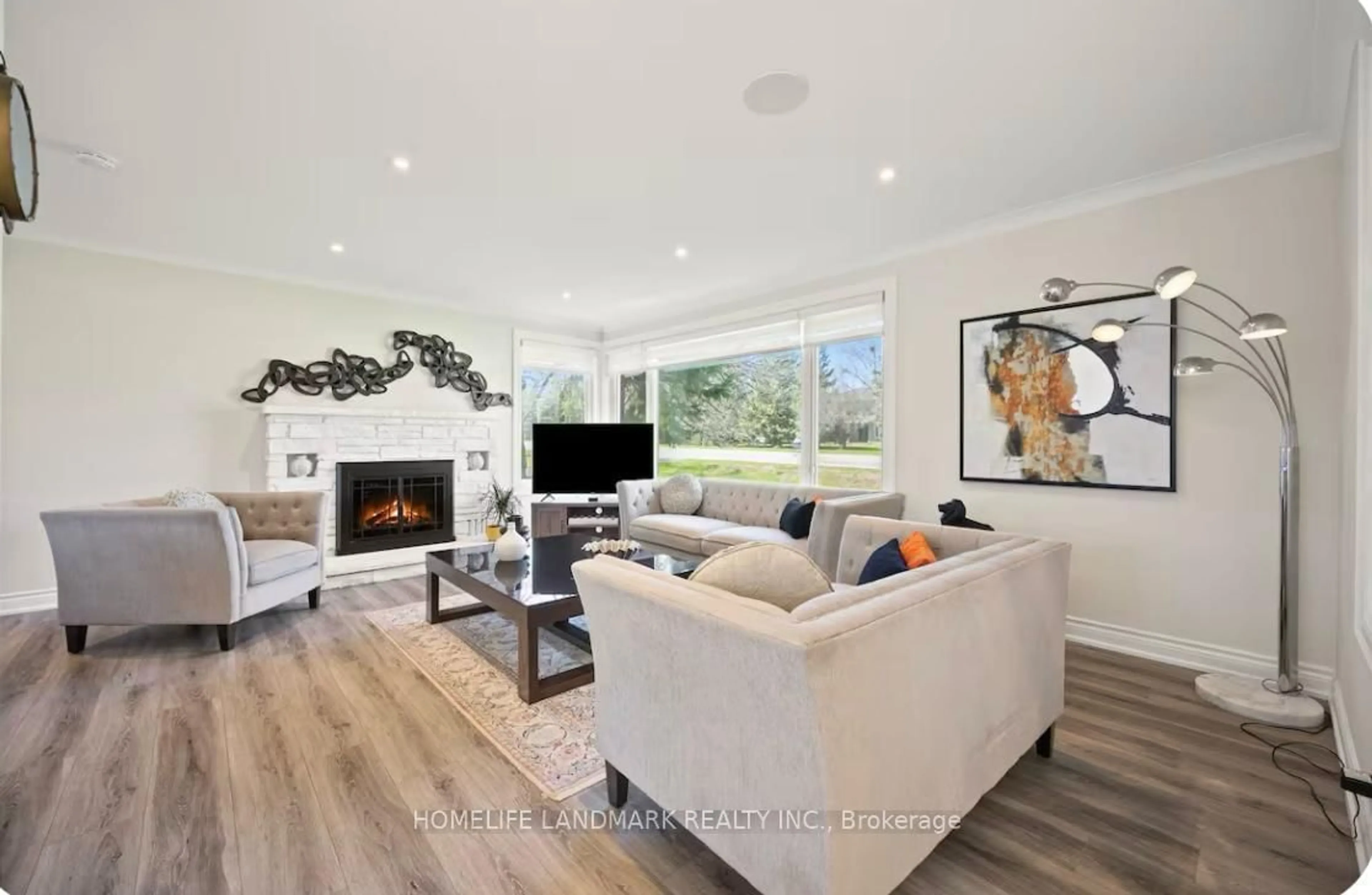 Living room with furniture, wood/laminate floor for 1739 Mount Albert Rd, East Gwillimbury Ontario L0G 1V0