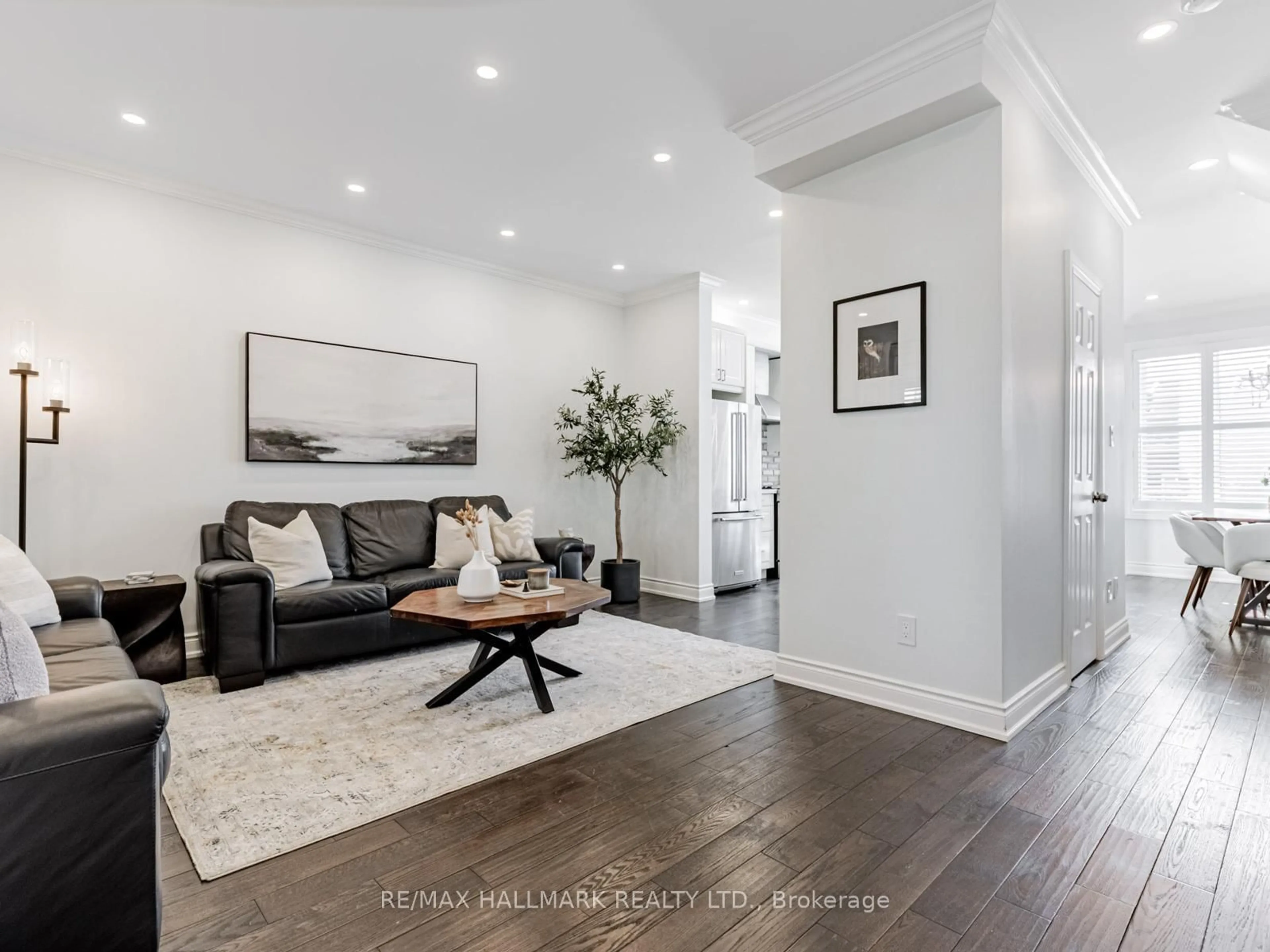 Living room with furniture, wood/laminate floor for 42 Dancers Dr, Markham Ontario L6C 2A6