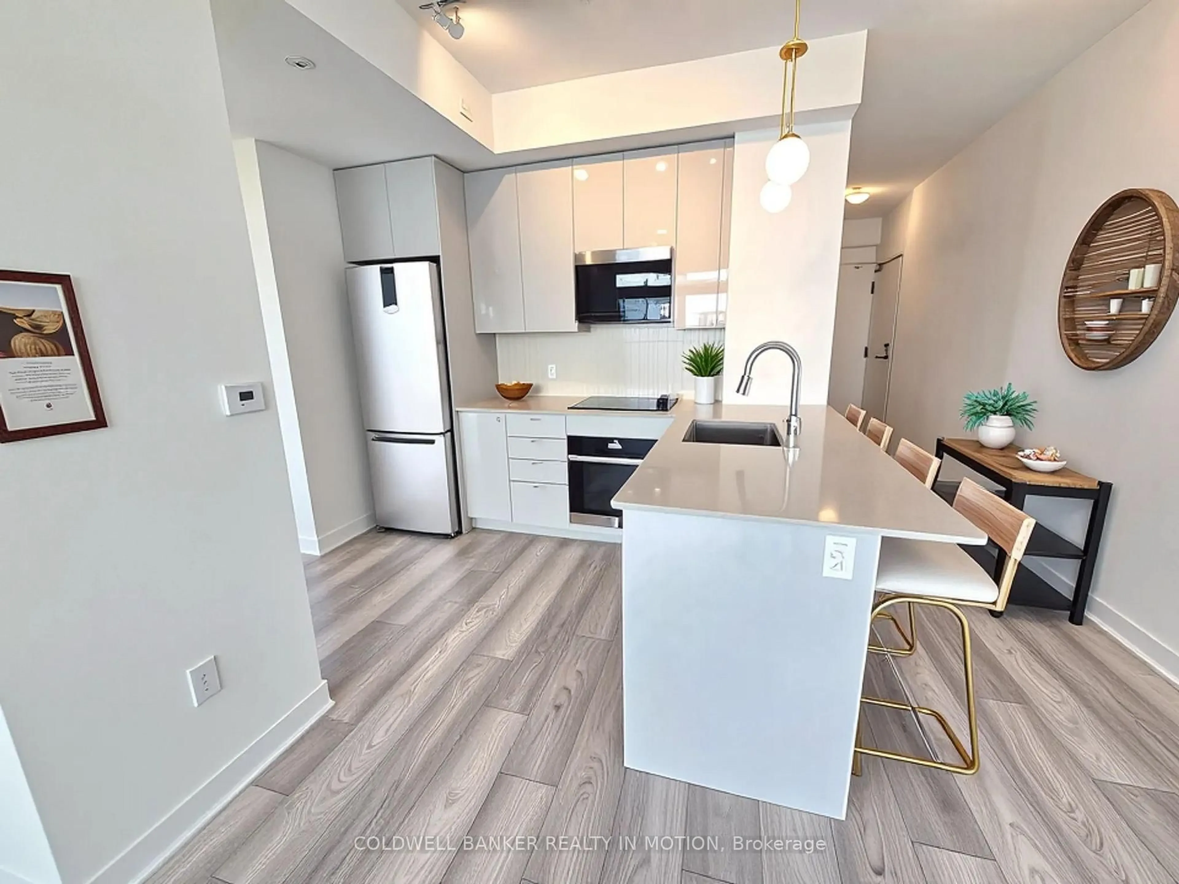 Open concept kitchen, wood/laminate floor for 10 Abeja St #2418, Vaughan Ontario L4K 0R4
