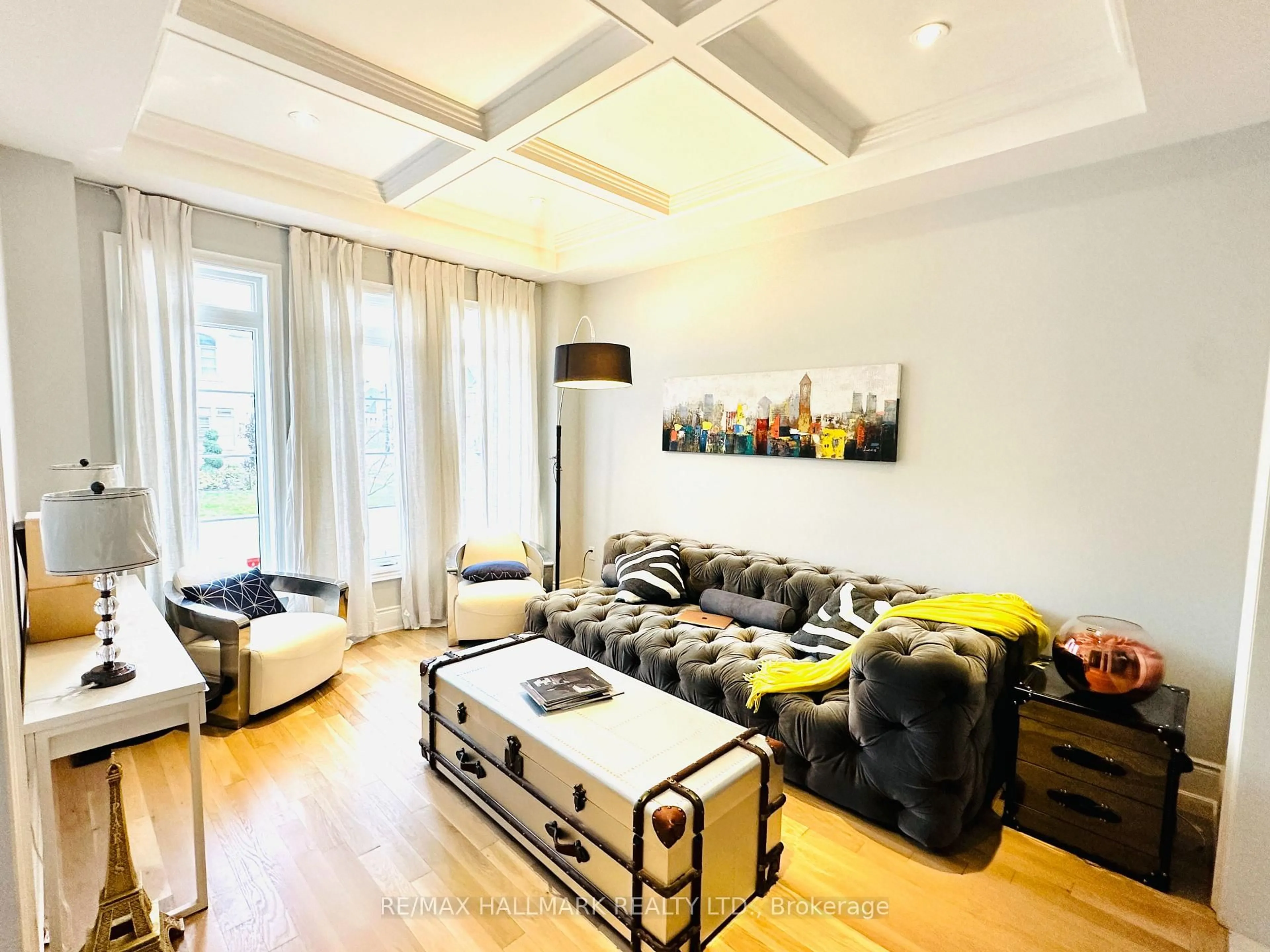 Living room with furniture, wood/laminate floor for 41 Glen Abbey Tr, Vaughan Ontario L4H 3X7