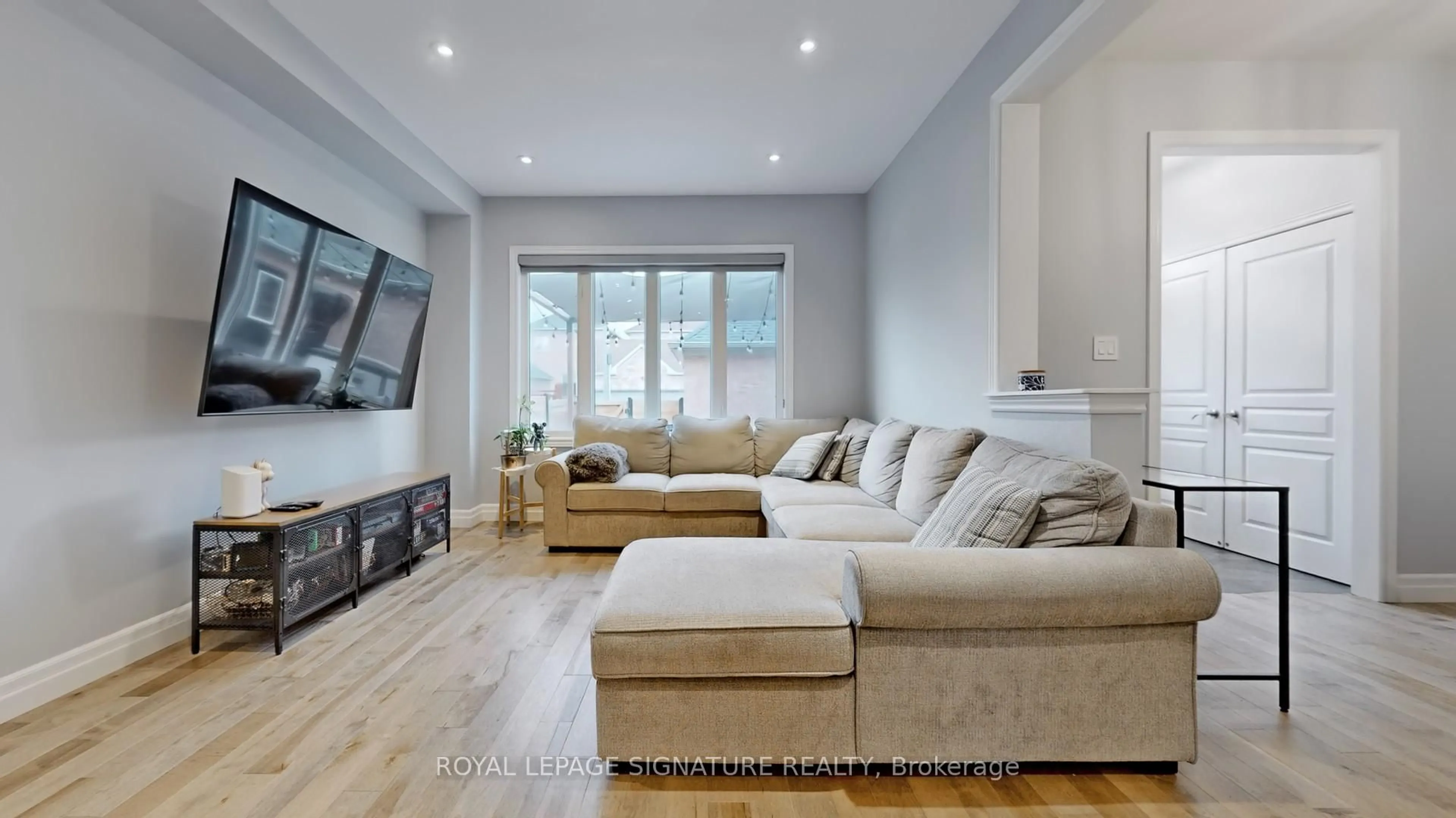 Living room with furniture, wood/laminate floor for 10 Foxton Rd, Markham Ontario L6B 0A9