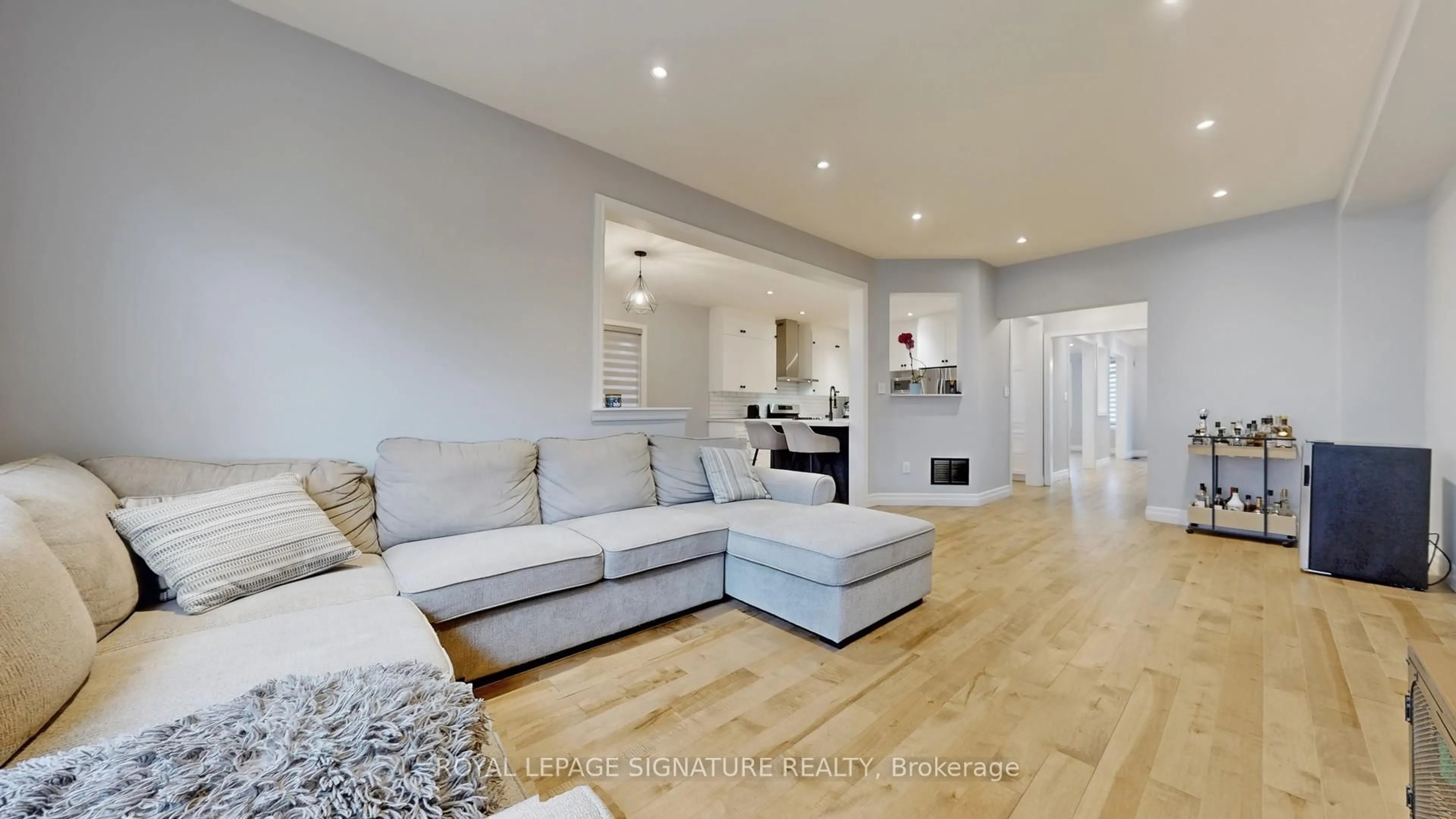 Living room with furniture, wood/laminate floor for 10 Foxton Rd, Markham Ontario L6B 0A9