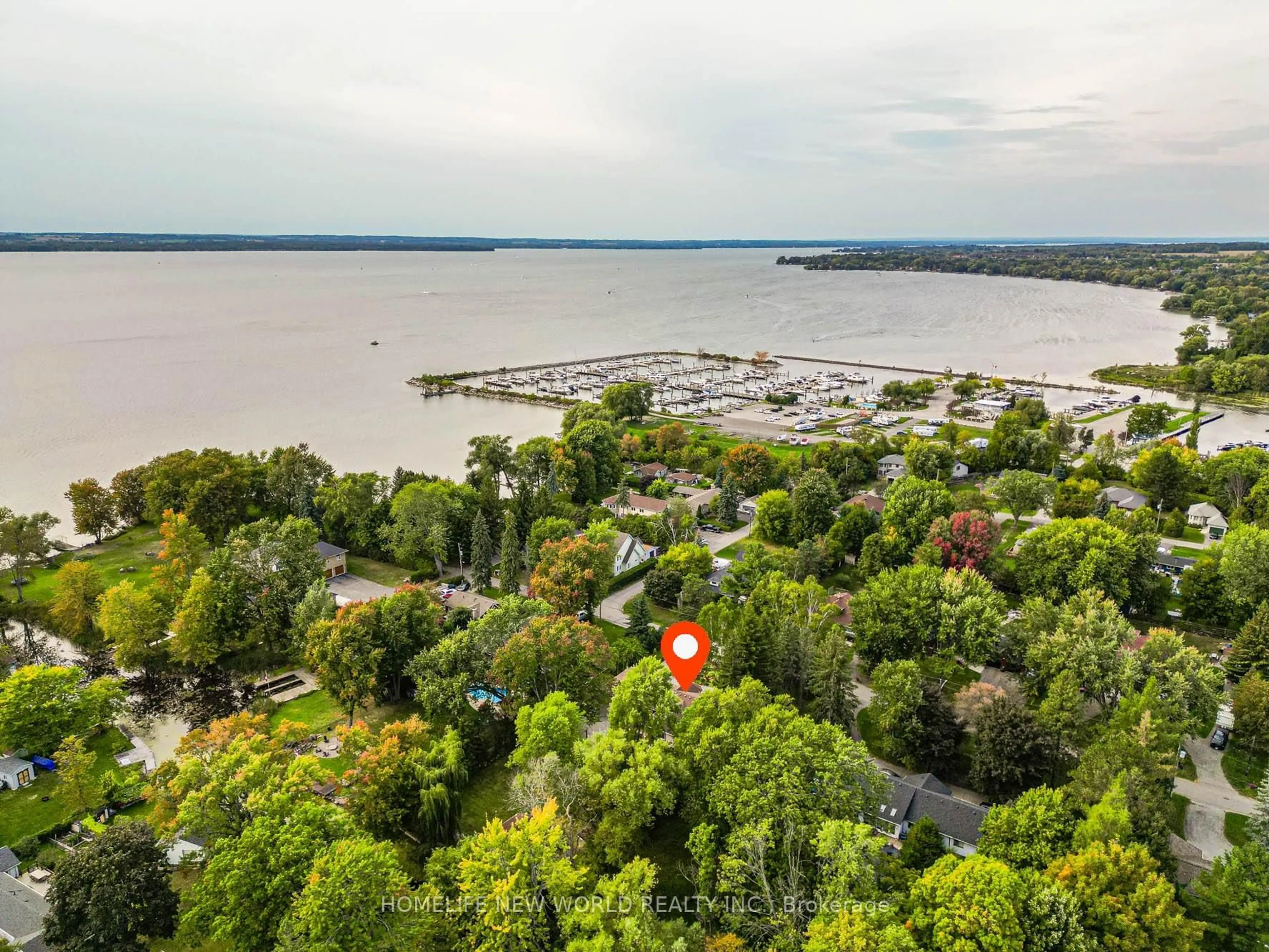 A pic from outside/outdoor area/front of a property/back of a property/a pic from drone, water/lake/river/ocean view for 215 Willow Dr, Georgina Ontario L4P 2R9