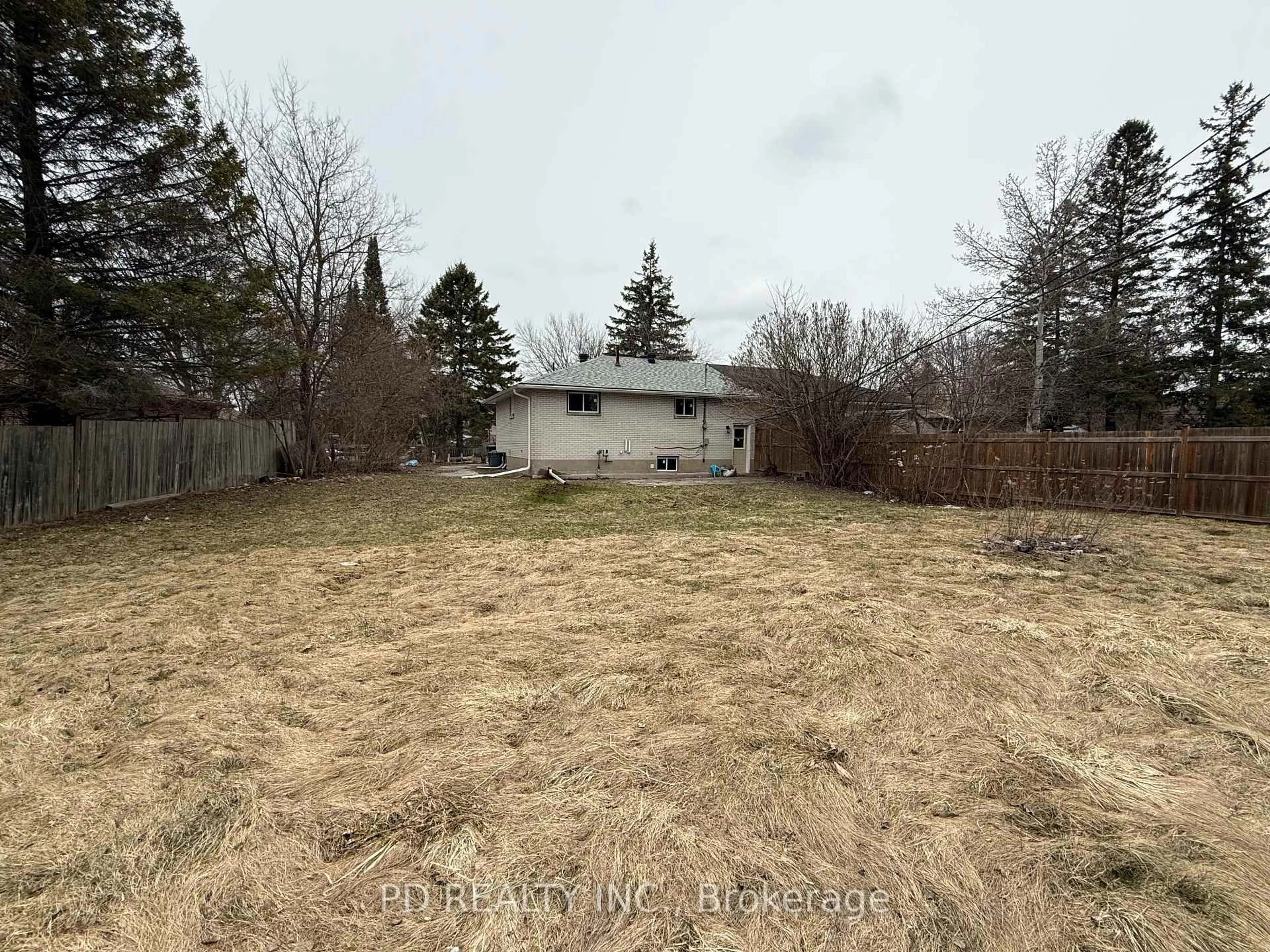 A pic from outside/outdoor area/front of a property/back of a property/a pic from drone, forest/trees view for 250 Cindy Lane, Essa Ontario L0M 1B0