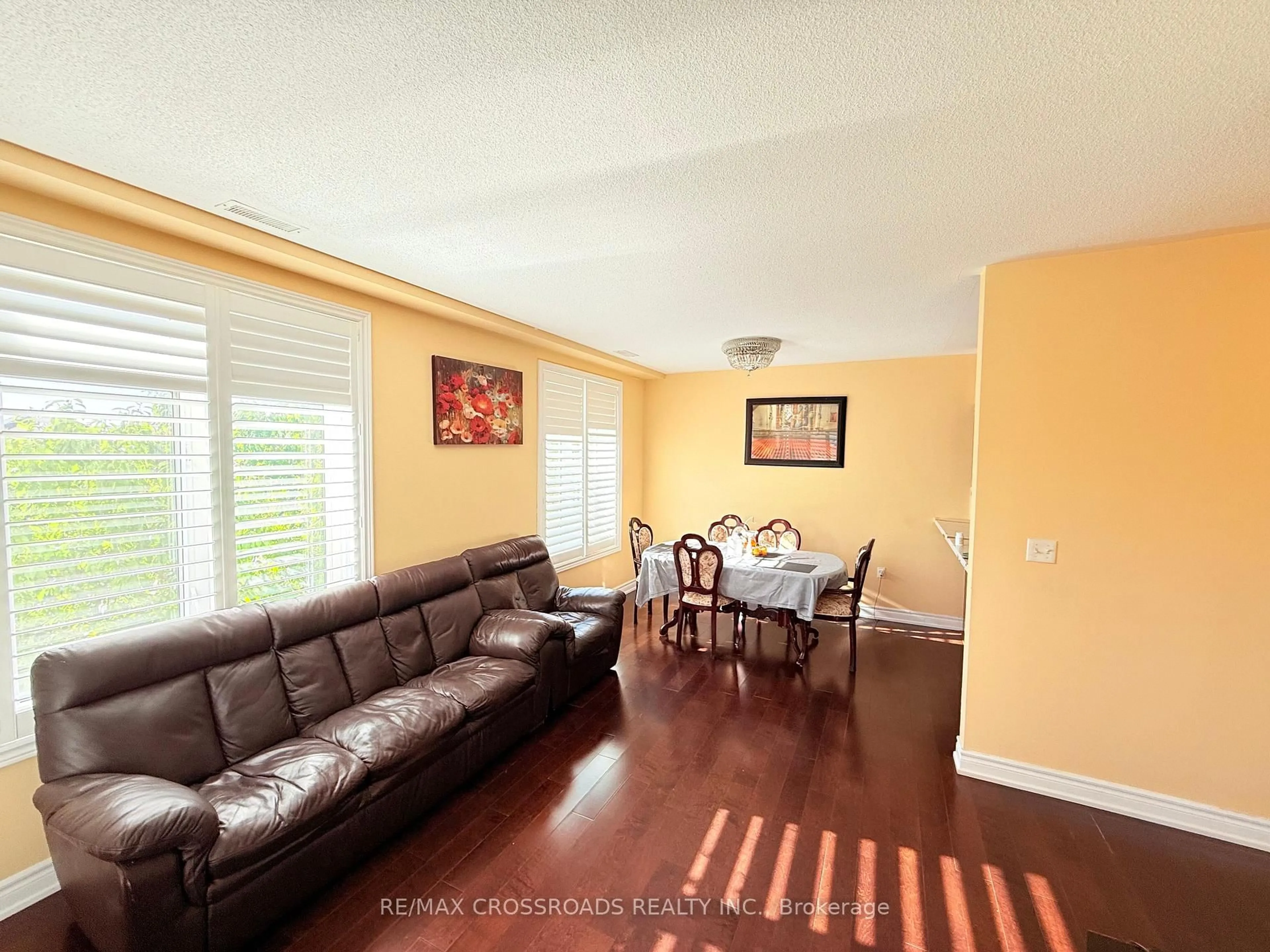 Living room with furniture, wood/laminate floor for 7340 Markham Rd #211, Markham Ontario L3S 0B1