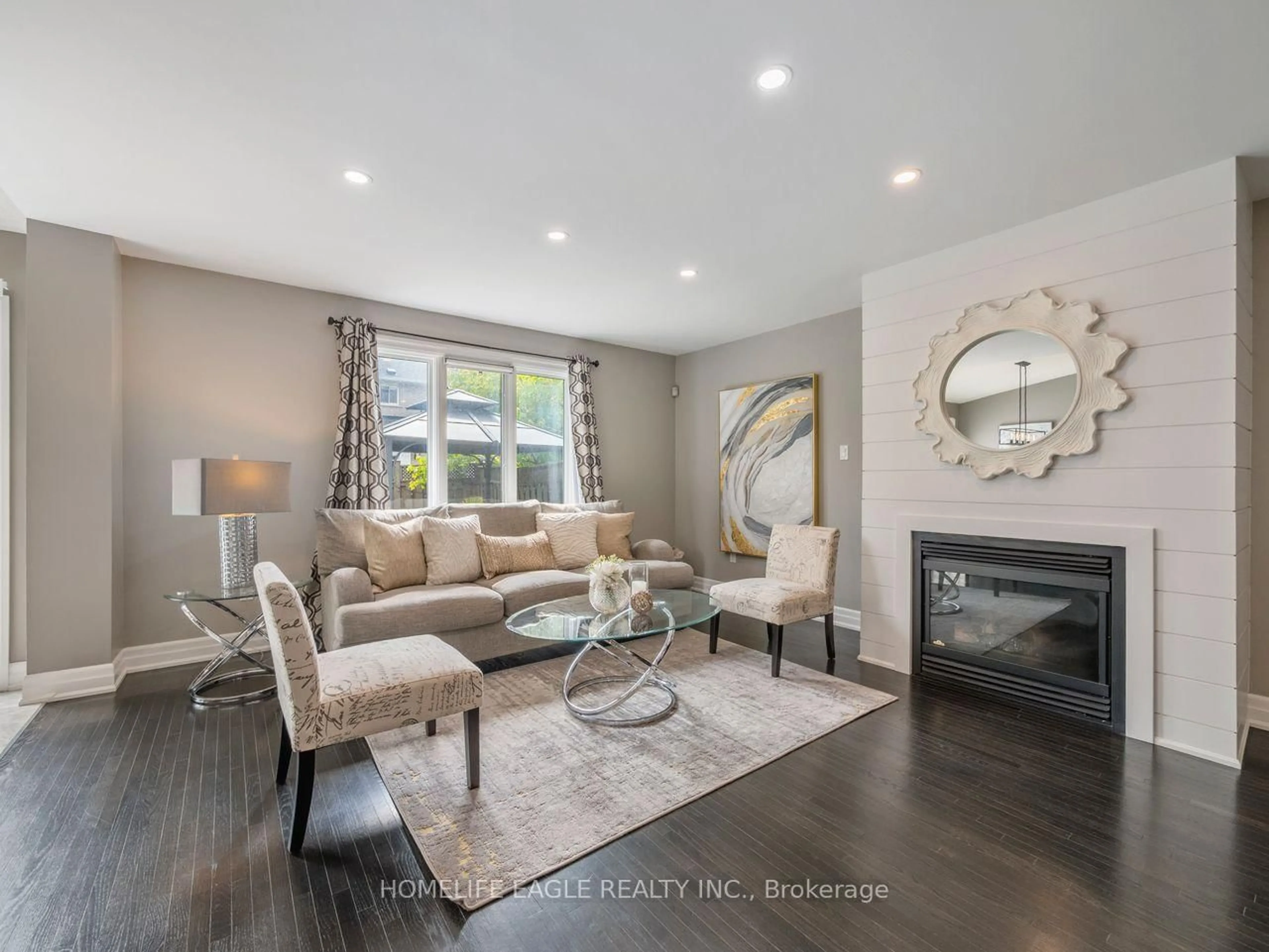 Living room with furniture, wood/laminate floor for 9 Marbella Rd, Vaughan Ontario L4H 1M3