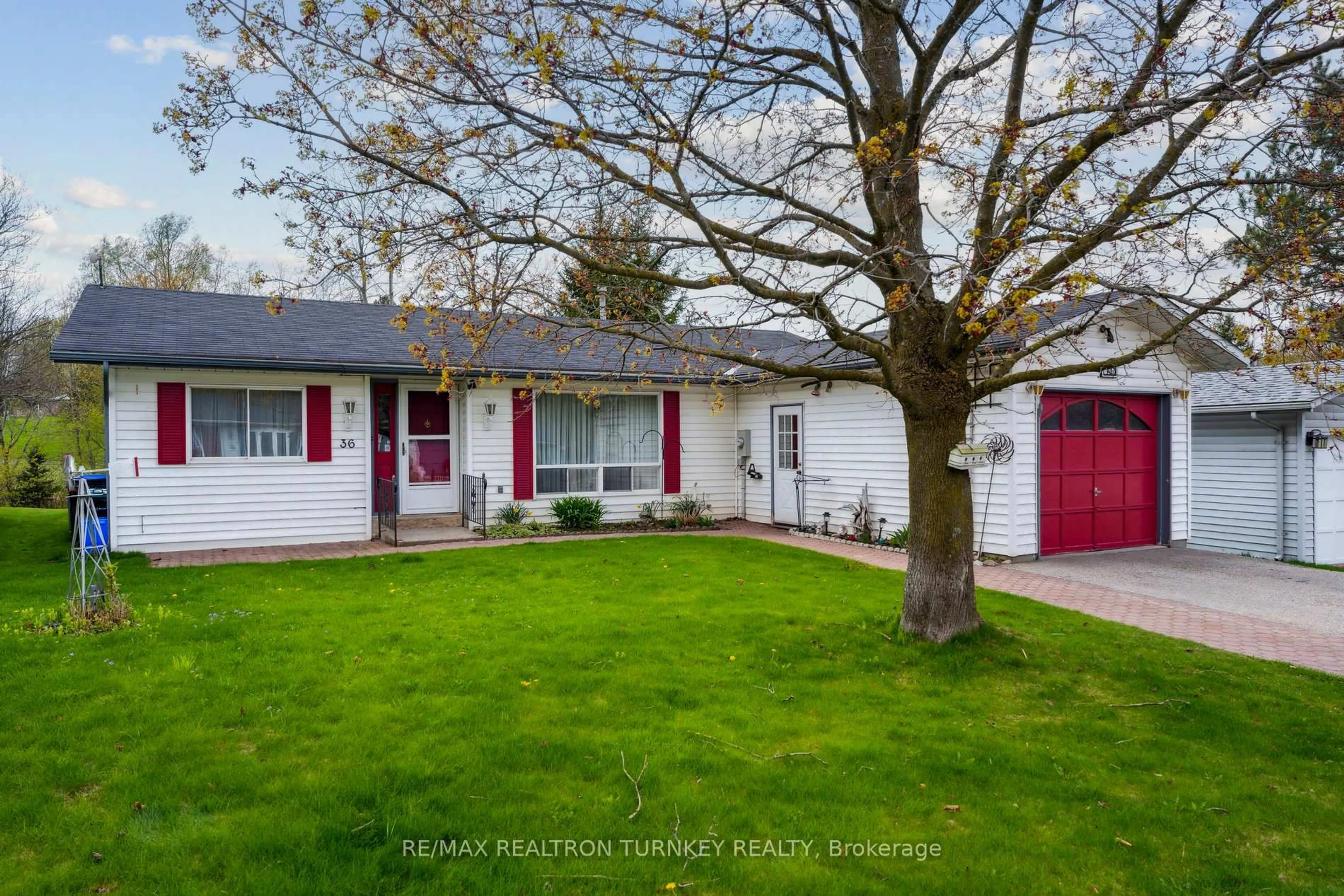 Home with vinyl exterior material, street for 36 Tecumseth Pines Dr, New Tecumseth Ontario L0G 1W0