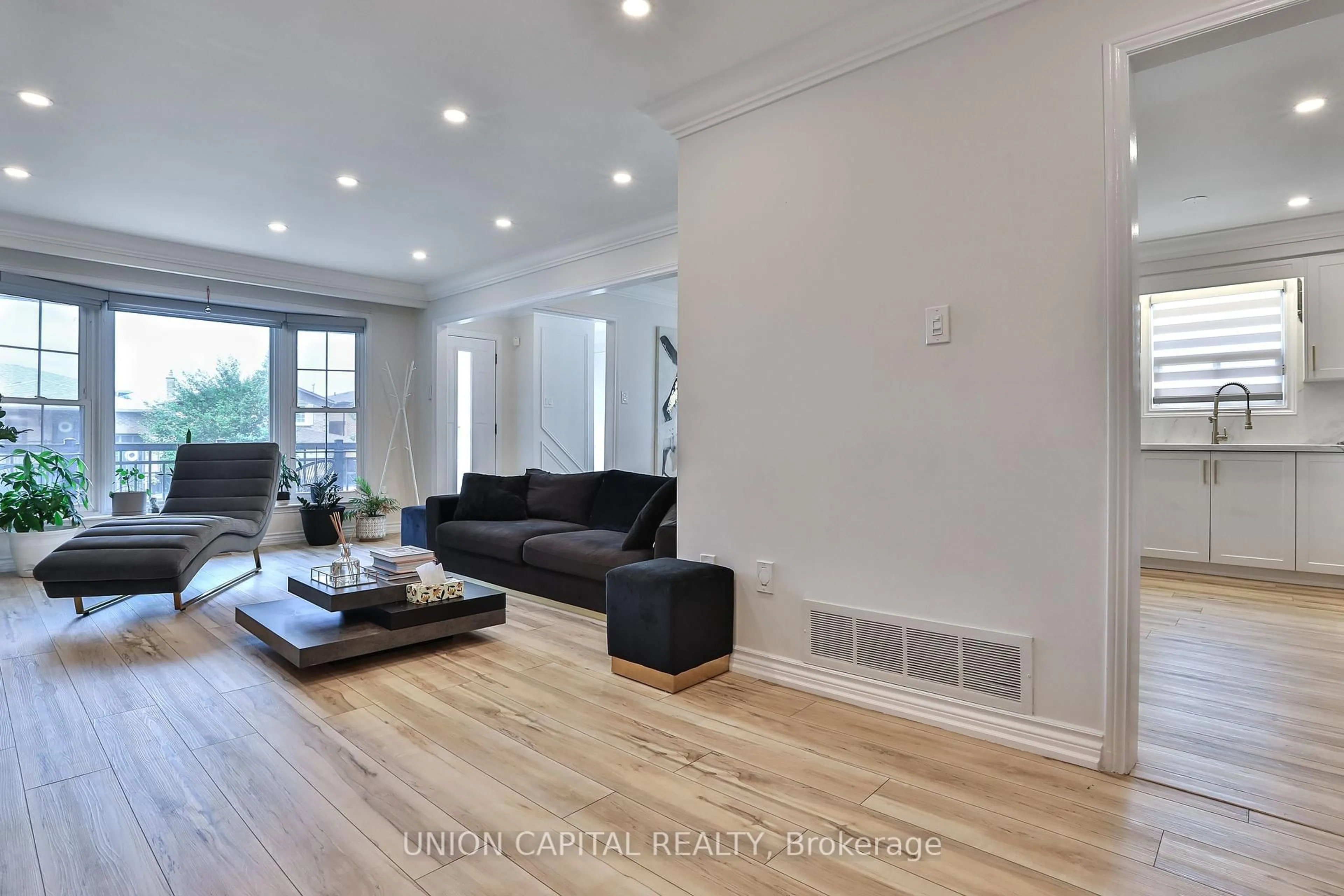 Living room with furniture, wood/laminate floor for 21 Avon Cres, Vaughan Ontario L4L 1H4