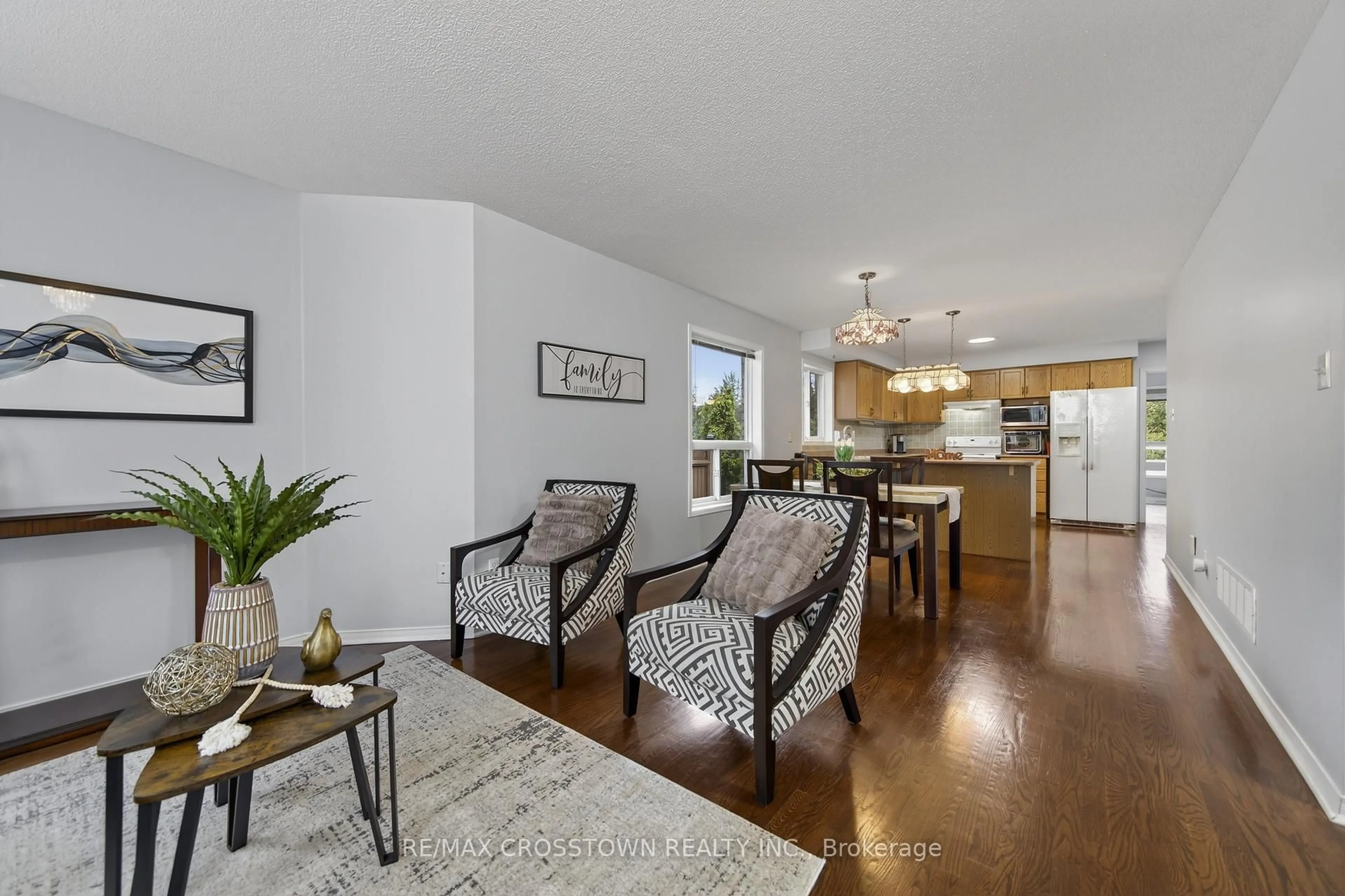 Living room with furniture, wood/laminate floor for 1258 Vincent Cres, Innisfil Ontario L9S 1Z6